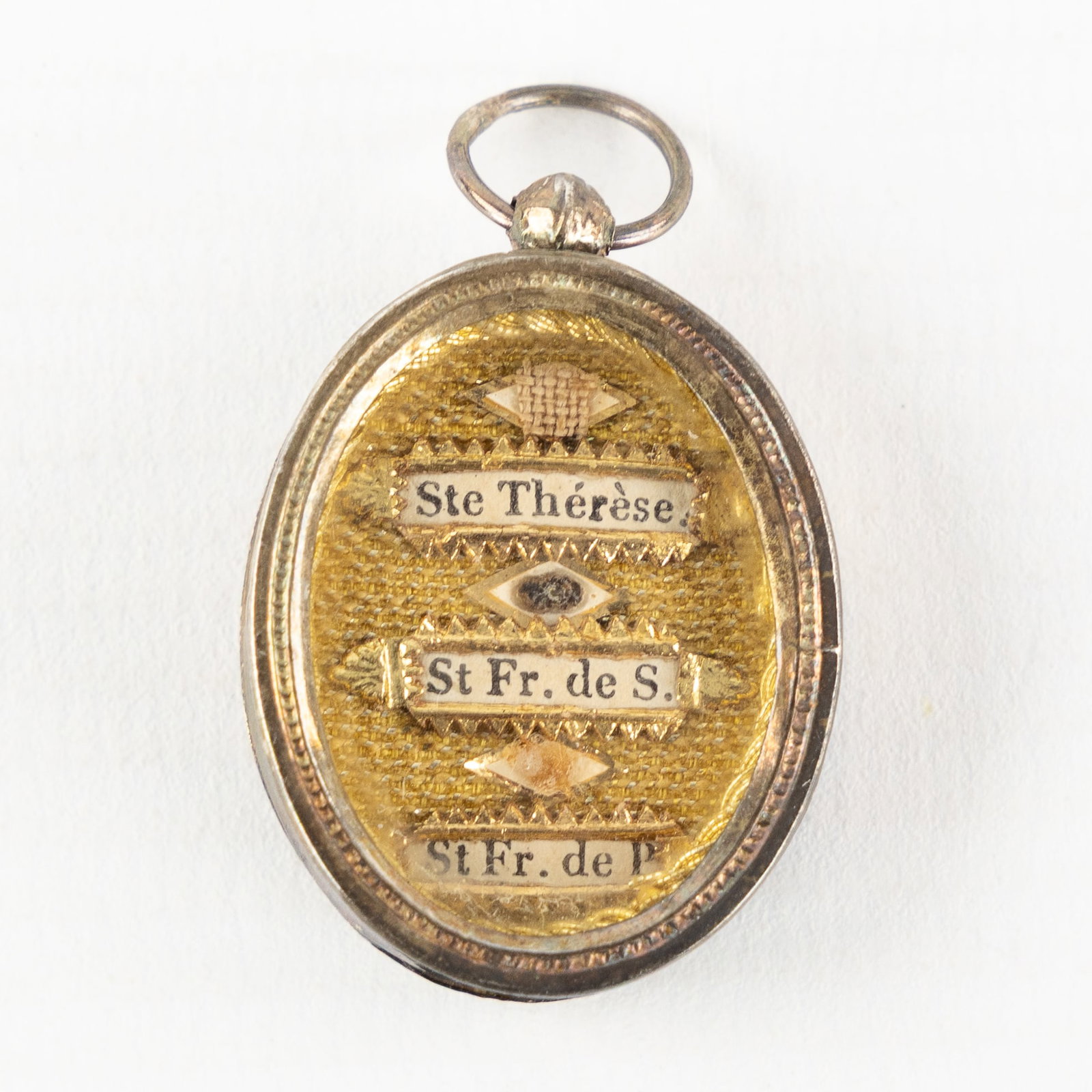 A Sealed multi-theca with relics for Saint Therese, Francis de Sales, and Francis of Paola, (1 of 4)