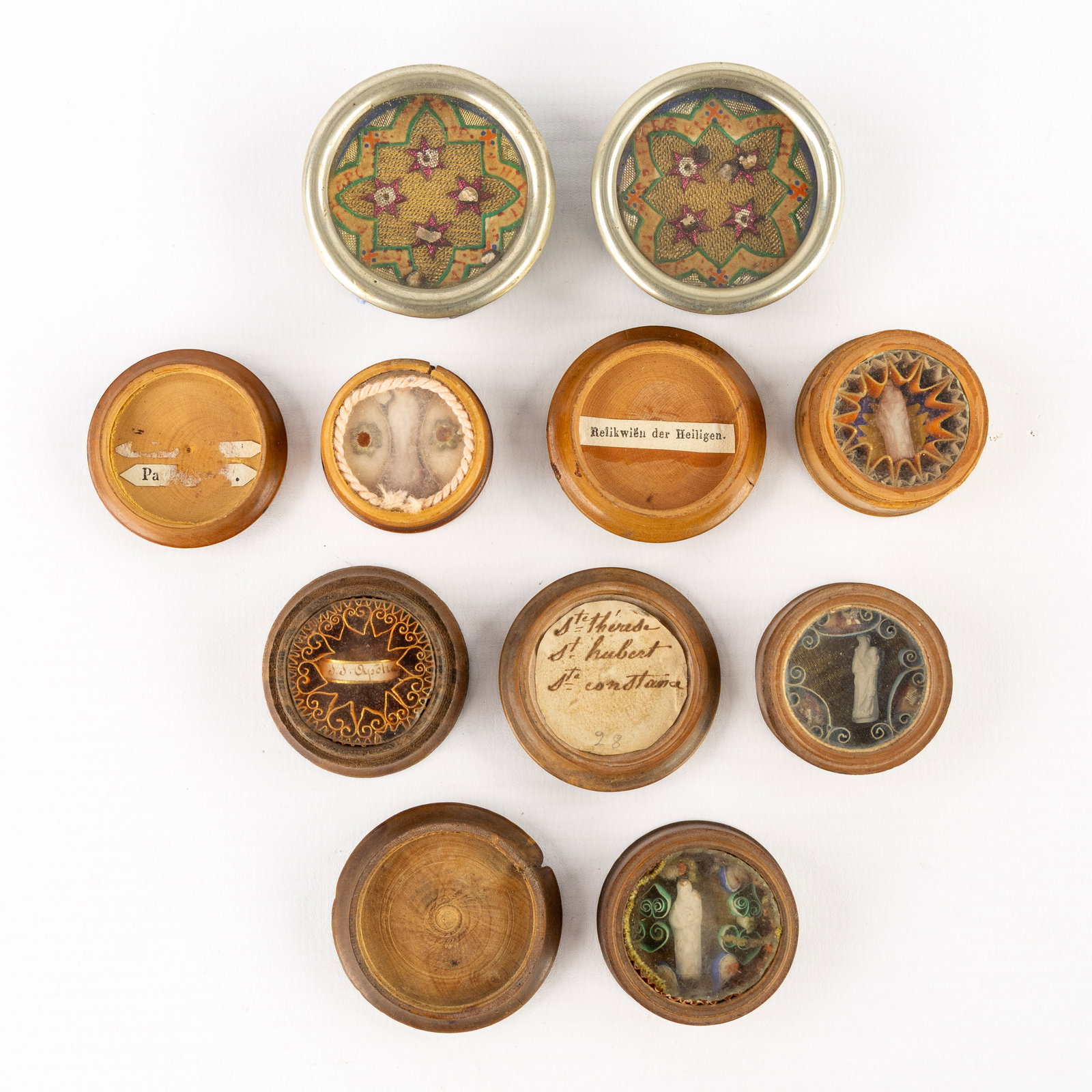 Two sealed multi-thecas containing relics, Added are 5 wooden travel reliquaries. (1 of 2)