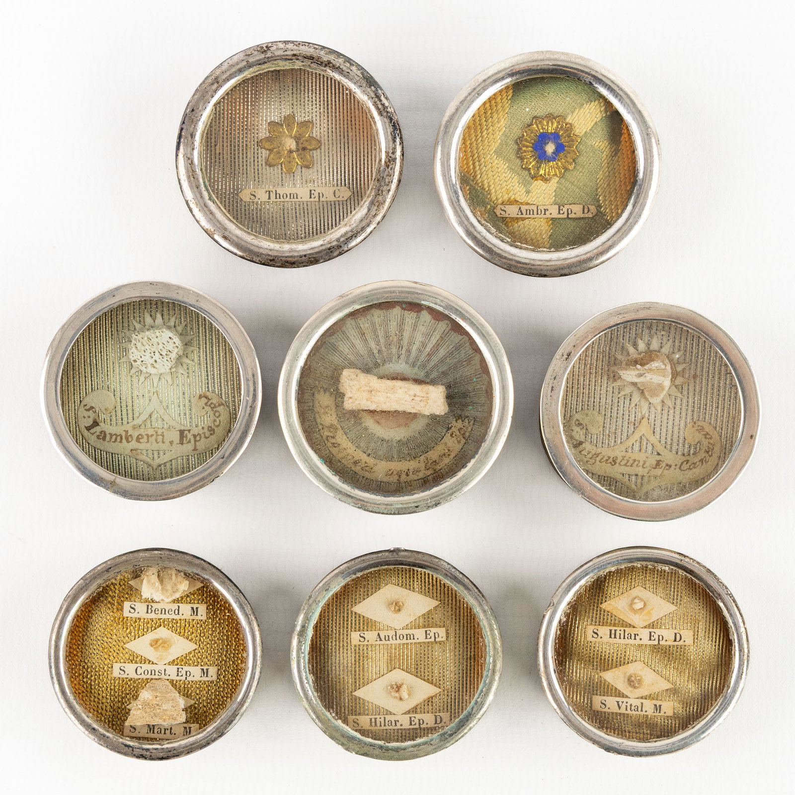 Eight sealed theca or reliquaries with relics for mostly Bishops and Saints. (1 of 2)