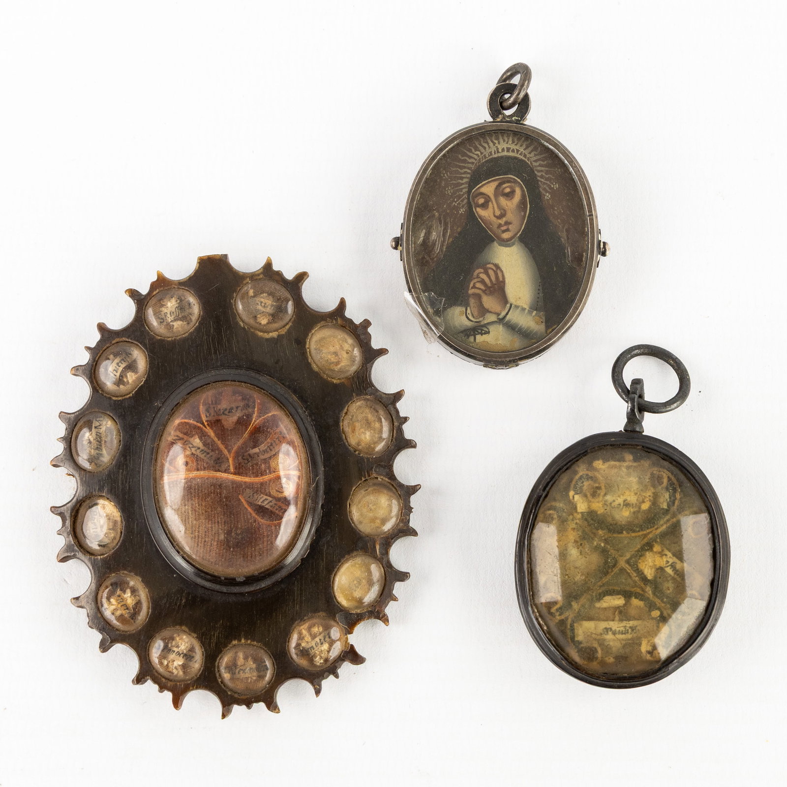 Three antique reliquary holders and devotional frames, sculptured horn and bronze. 17th/18th C. (1 of 3)