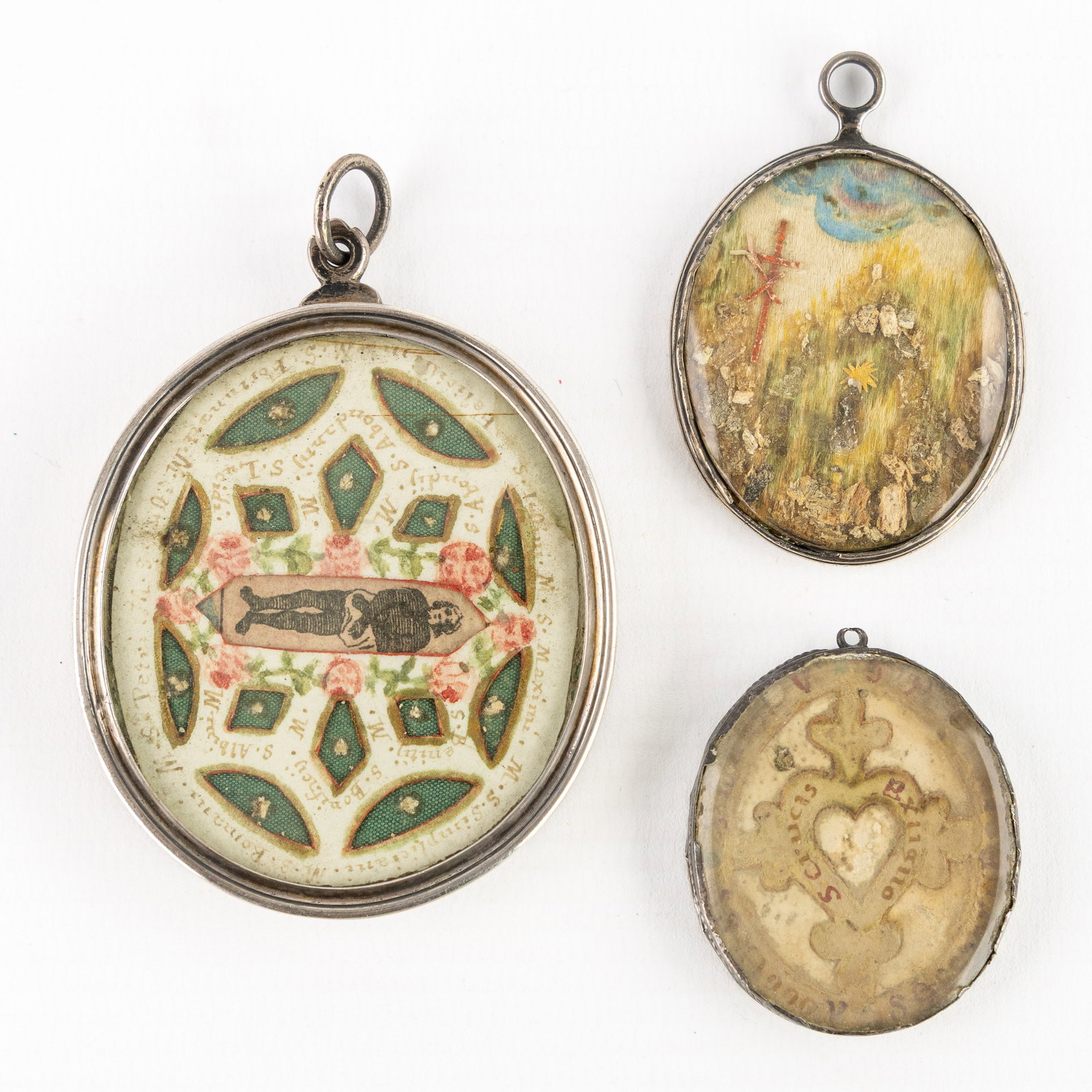 Three relics and devotional pendants, containing relics of the Holy Cross and saints, miniature (1 of 6)