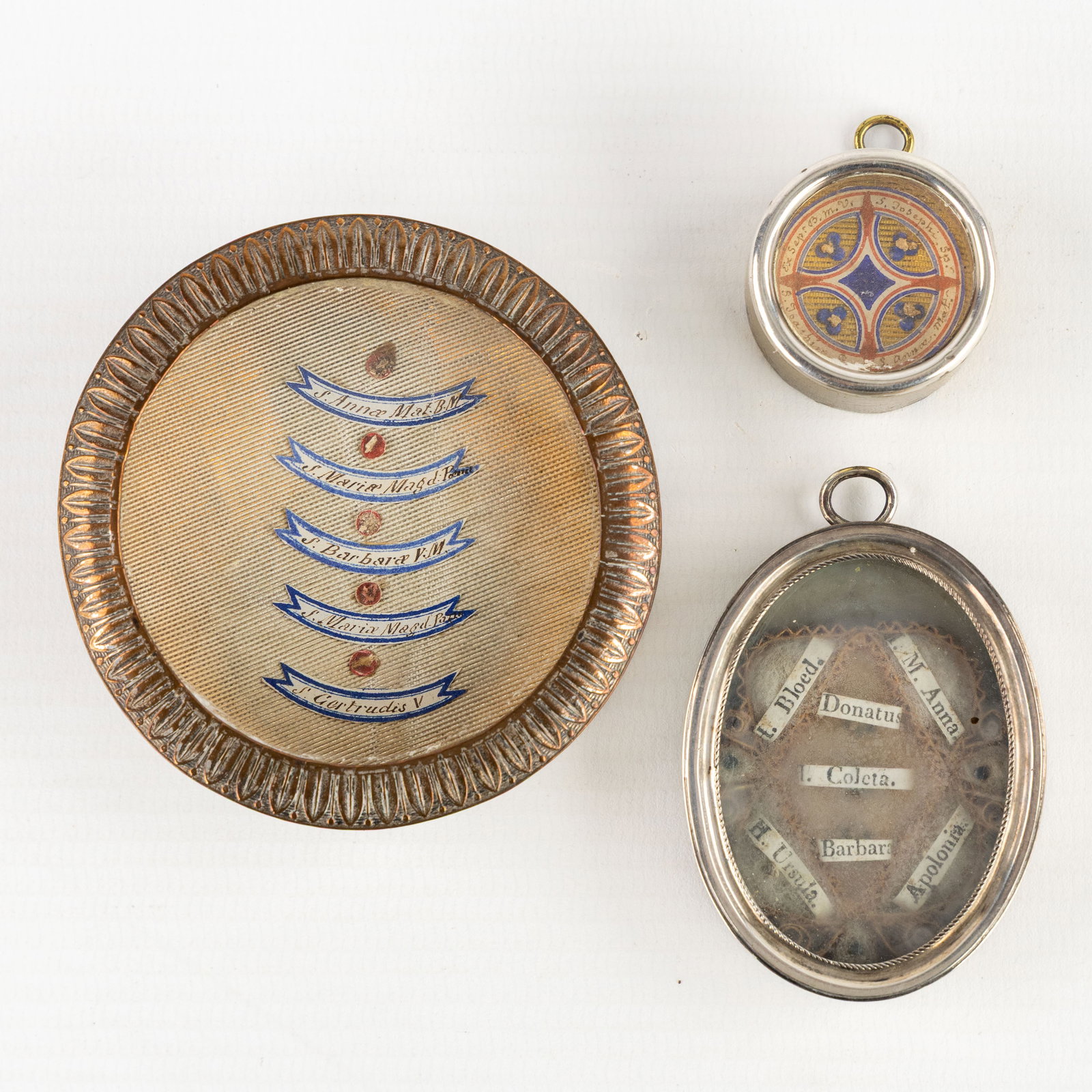 Three Multi-theca, two of which are sealed, with relics of the Holy Family and Saints. (1 of 2)