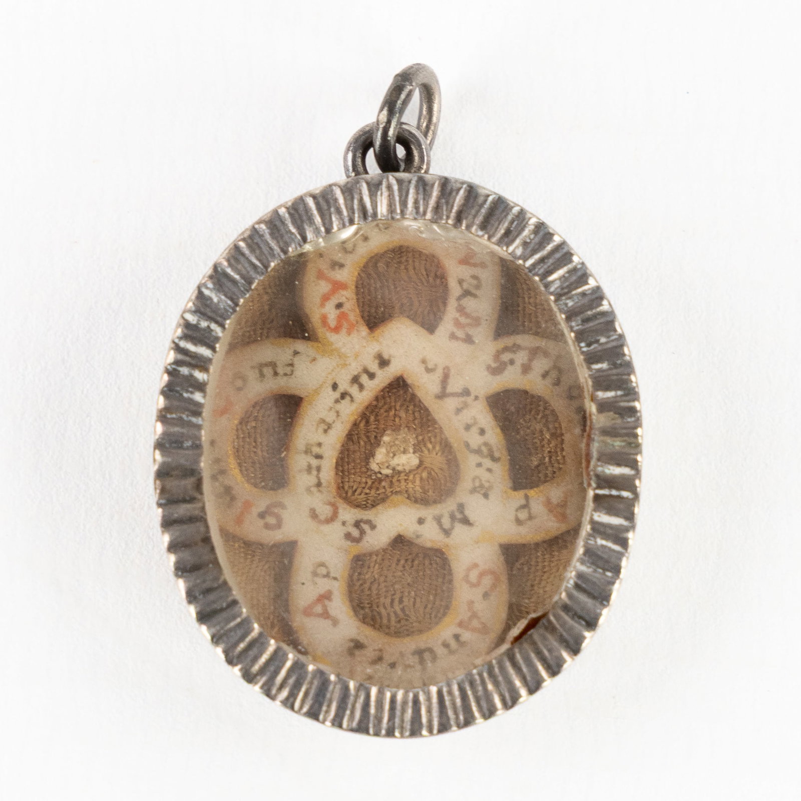 A multi-theca with 5 relics, mounted in a pendant made by Augustinus Louis Bourgois, Ypres, Belgium, (1 of 2)