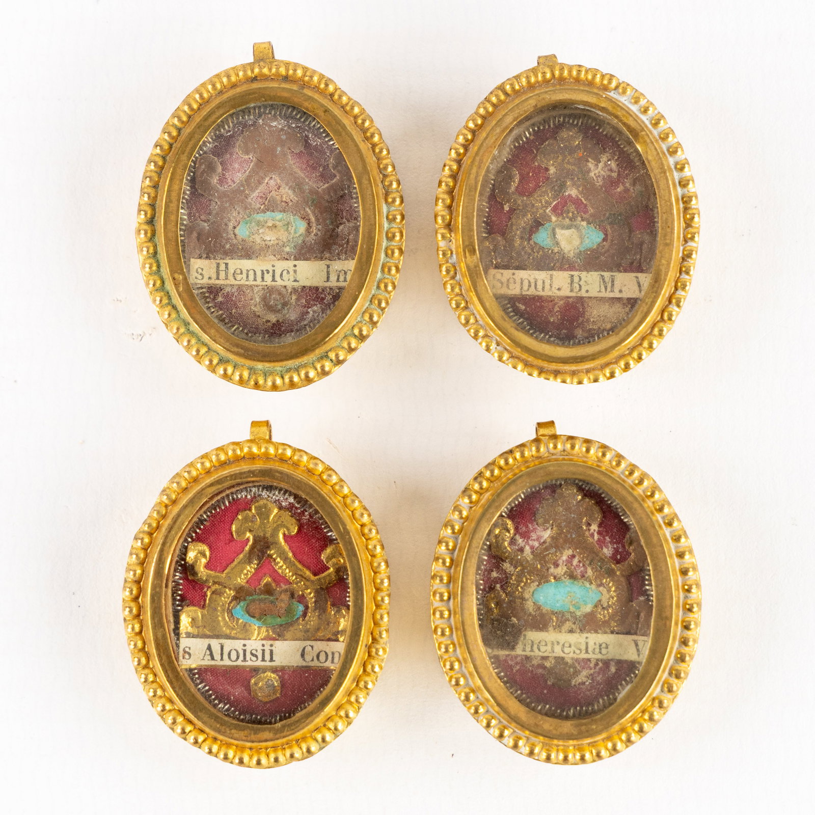 Four sealed theca with relics for The Virgin Mary, Aloysius Gonzaga, Saint Theresia and Saint Henry: Four sealed theca with relics for The Virgin Mary, Aloysius Gonzaga, Saint Theresia and Saint Henry II the Emperor. Including the document. 1. From the grave of Saint Aloysius Gonzaga, Confessor. (Ex