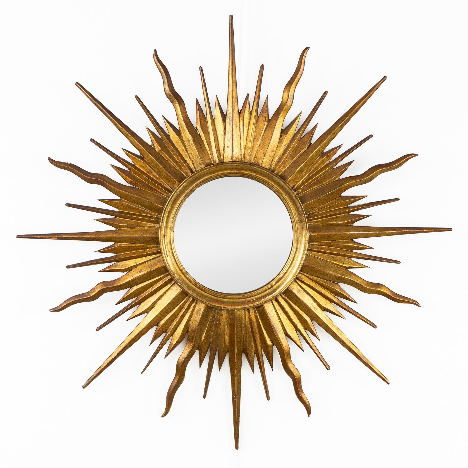 A Mid-Century sunburst mirror, sculptured wood and convex glass. Circa 1970. (1 of 5)