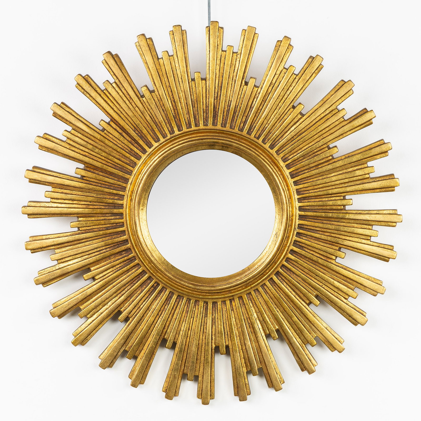 A Mid-Century Sunburst Mirror, Gilded, Convex Glass. Circa 1970.: A Mid-Century Sunburst Mirror, Gilded, Convex Glass. Circa 1970. Convex glass.Gilded resin.Circa 1970. Dimensions: (W:54 cm) The absence of a condition report does not imply a perfect item. Please sen