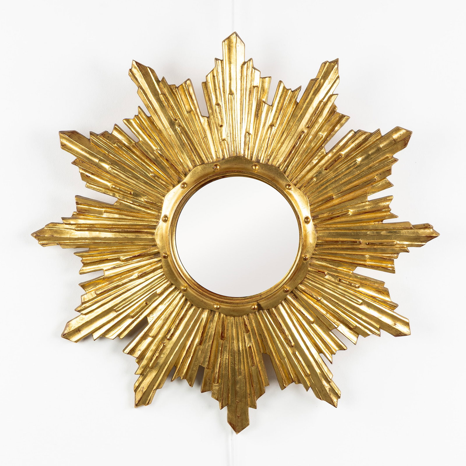 A Mid-Century Sunburst Mirror, Gilded, Convex Glass. Circa 1970.: A Mid-Century Sunburst Mirror, Gilded, Convex Glass. Circa 1970. Convex glass.Gilded resin.Circa 1970. Dimensions: (W:65 cm) The absence of a condition report does not imply a perfect item. Please sen