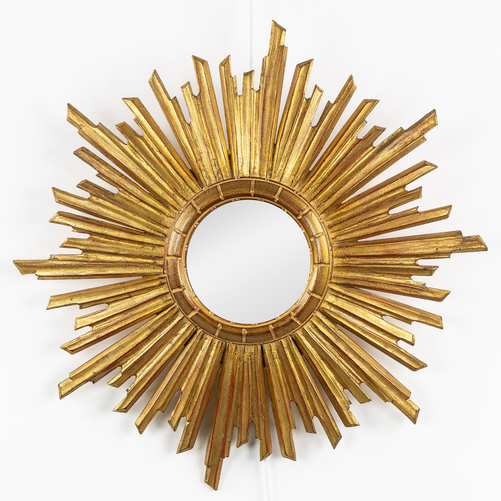 A Large Mid-Century sunburst mirror, gilded and sculptured wood, Convex Glass. Circa 1970. (1 of 4)