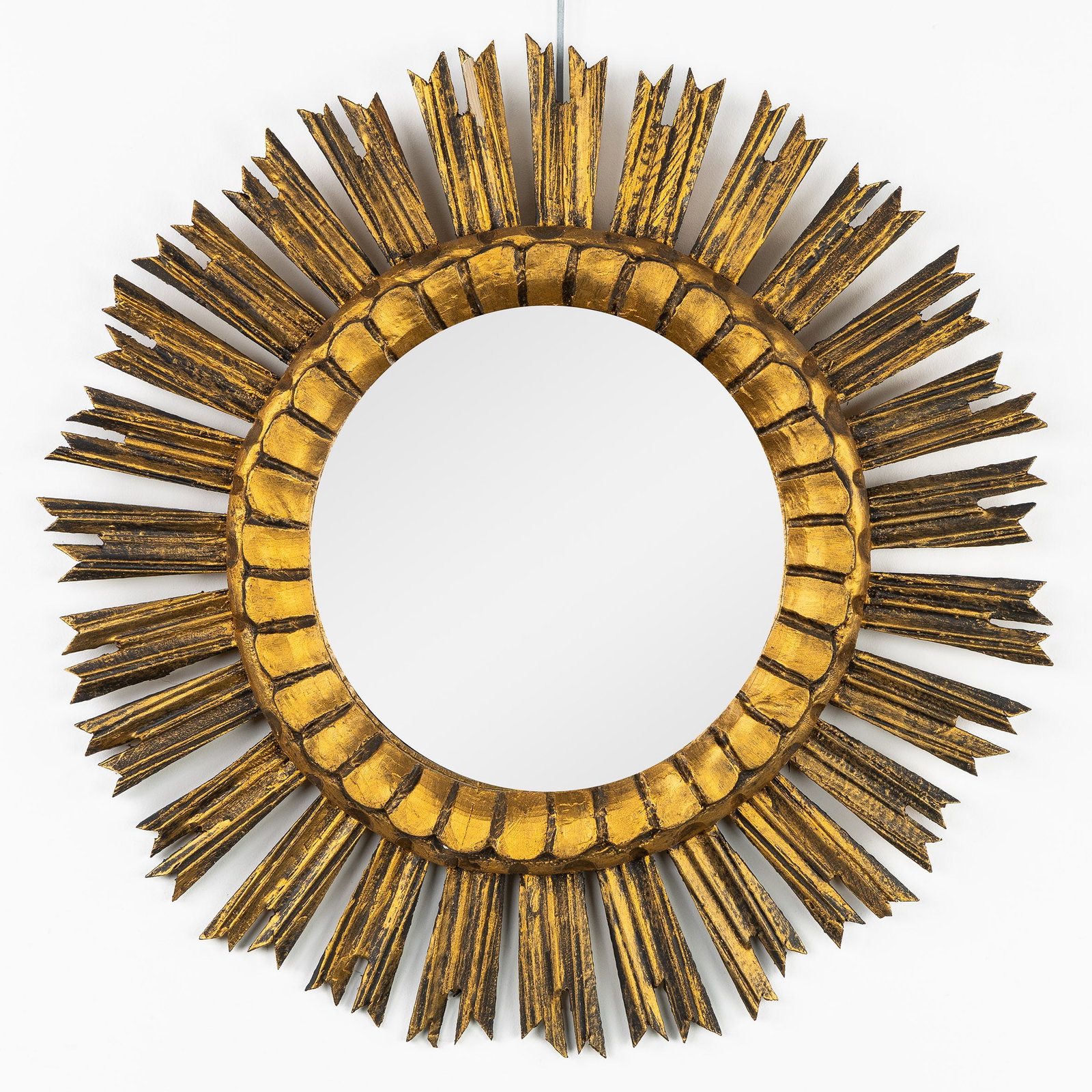 A Mid-Century Sunburst Mirror, Gilt wood, lightly convex glass. Circa 1970. (1 of 4)