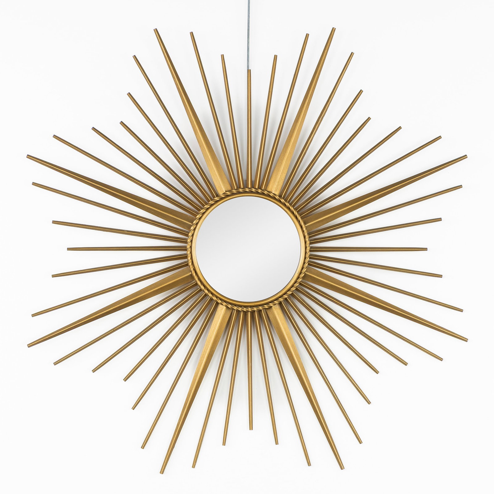 Chaty Vallauris, A Mid-Century Sunburst Mirror, Convex Glass.: Chaty Vallauris, A Mid-Century Sunburst Mirror, Convex Glass. Convex glass. Patinated metal. Marked Chaty Vallauris. Dimensions: (W:85 cm) The absence of a condition report does not imply a perfect it