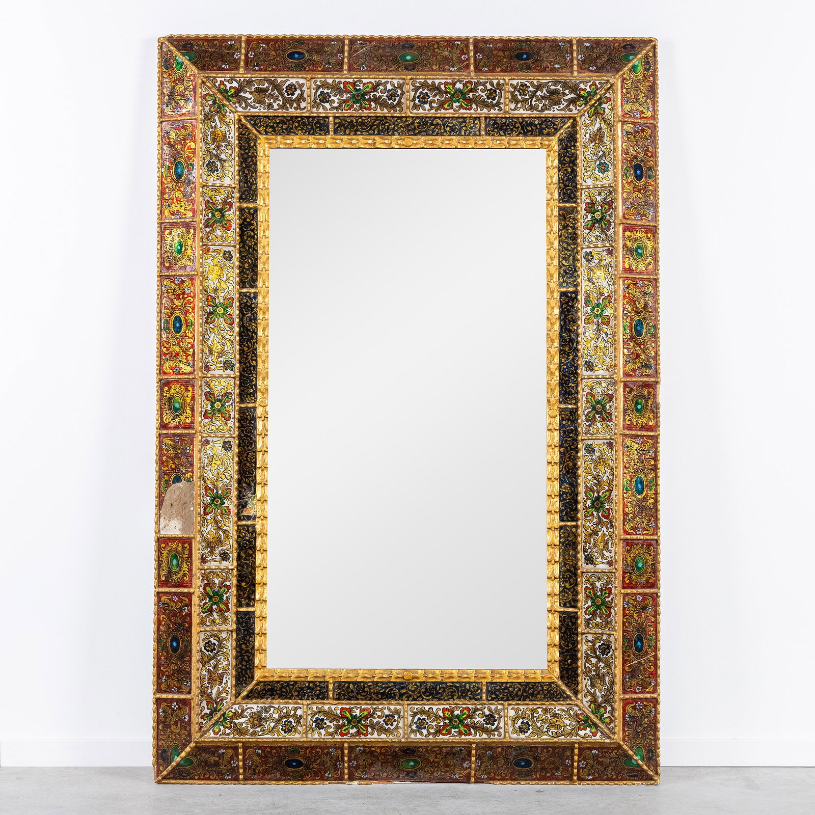 An Impressive Mirror with a Gilded Frame finished with Polychrome and Gilded Reverse Glass: An Impressive Mirror with a Gilded Frame finished with Polychrome and Gilded Reverse Glass Paintings. Wooden, gilded frame with three levels. Finished with polychrome and gilded reverse glass painting