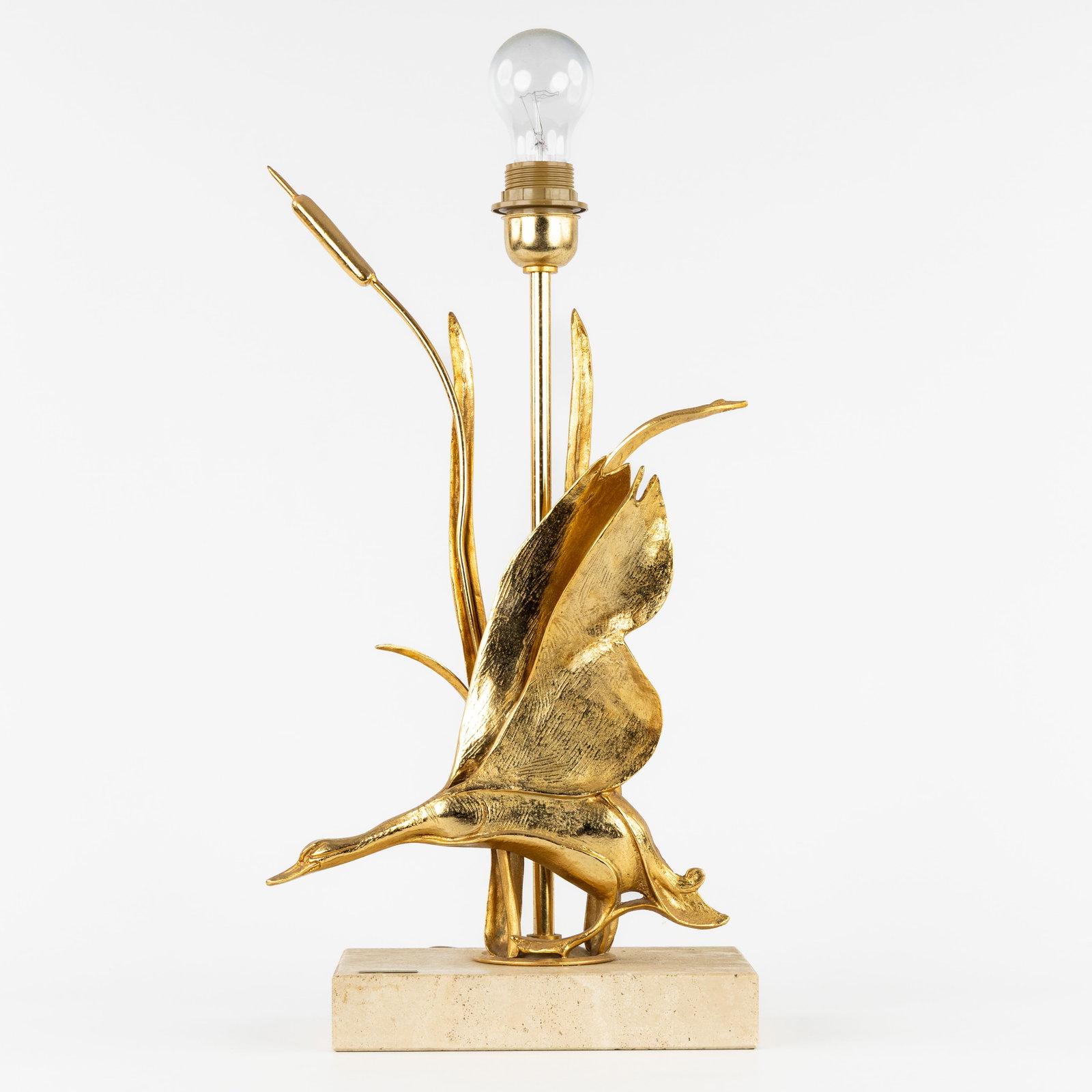 Lanciotto Galeotti (1945) a table lamp, gilt brass and bronze, for L'Originale, Italy, circa 1970.: Lanciotto Galeotti (1945) a table lamp, gilt brass and bronze, for L'Originale, Italy, circa 1970. Gilded brass/bronze and travertine.Table lamp decorated with flying duck among cattails and reeds.Des