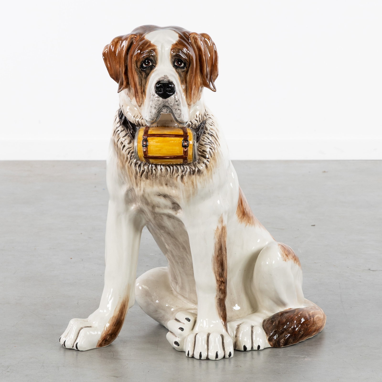 A Large Saint Bernard dog, Polychrome glazed ceramics, Italy, 20th C.: A Large Saint Bernard dog, Polychrome glazed ceramics, Italy, 20th century. Marked 'C.S.M. - Italy - A/7473'. Dimensions: (W:40 x H:70 x L:55 cm) The absence of a condition report does not imply a per