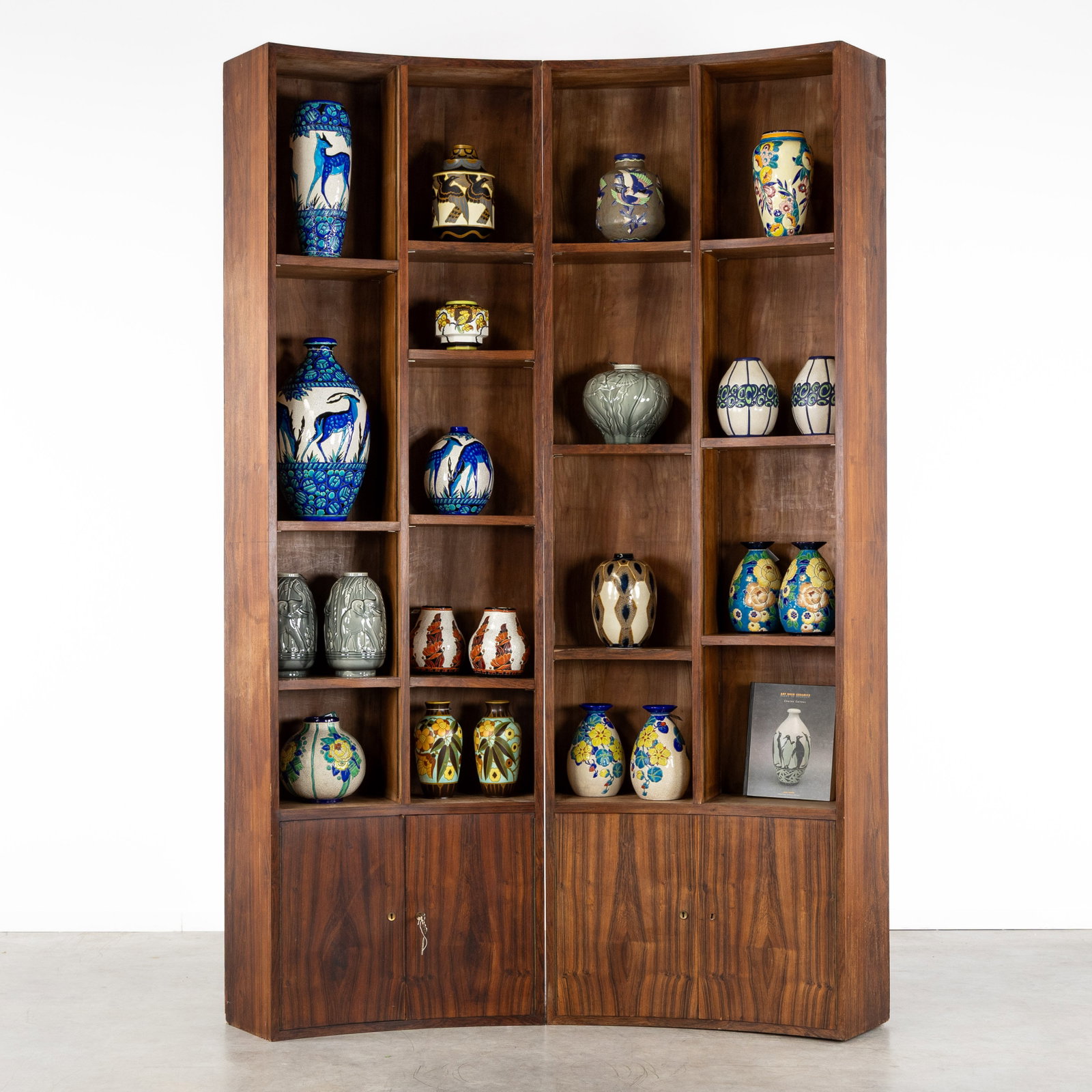 A Pair of exceptional library or display cabinets, rosewood veneer, in the style of Bruno Paul, (1 of 8)