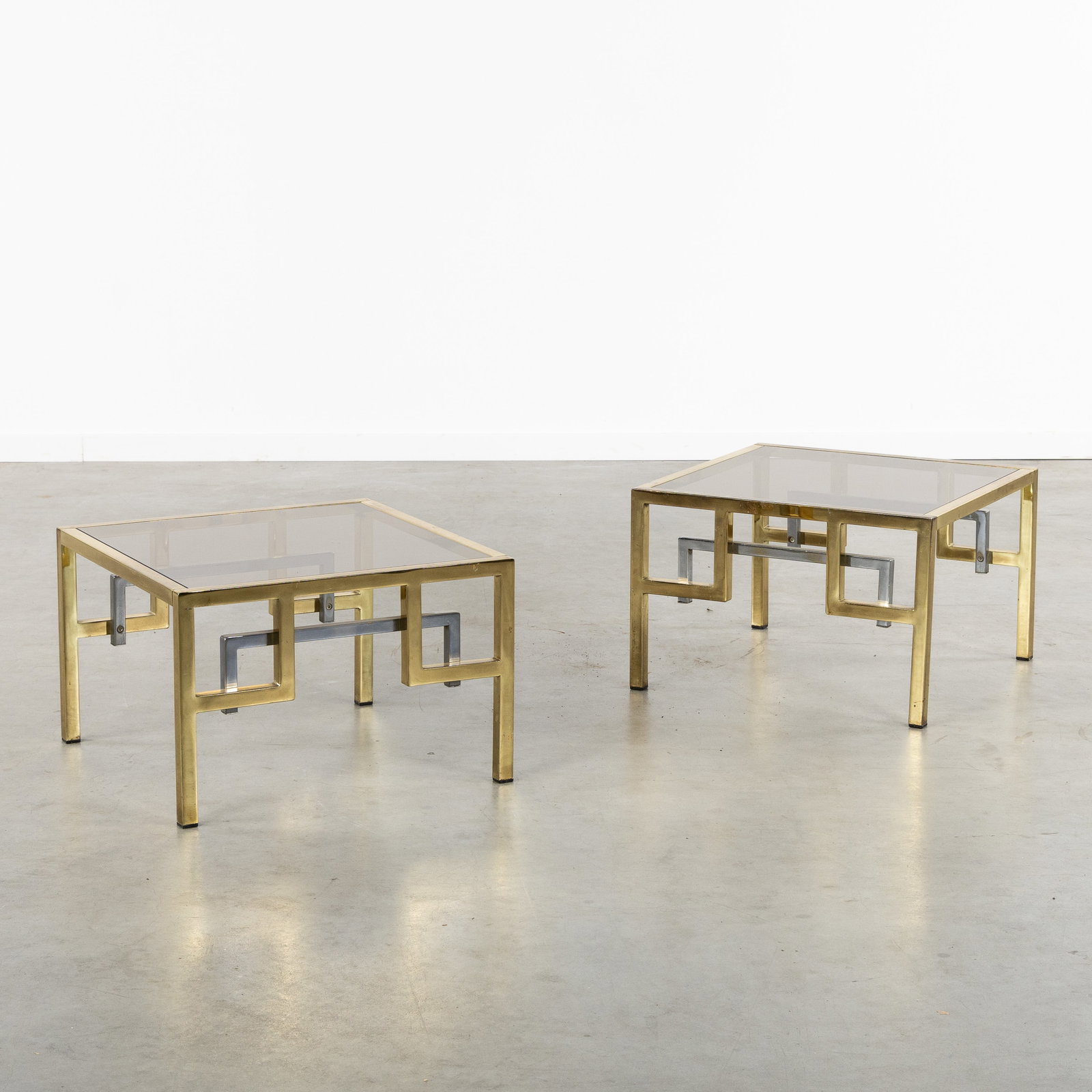 Belgo Chrom, a Pair of Side tables. Gilded and chromed metal and glass. Circa 1970. (1 of 6)
