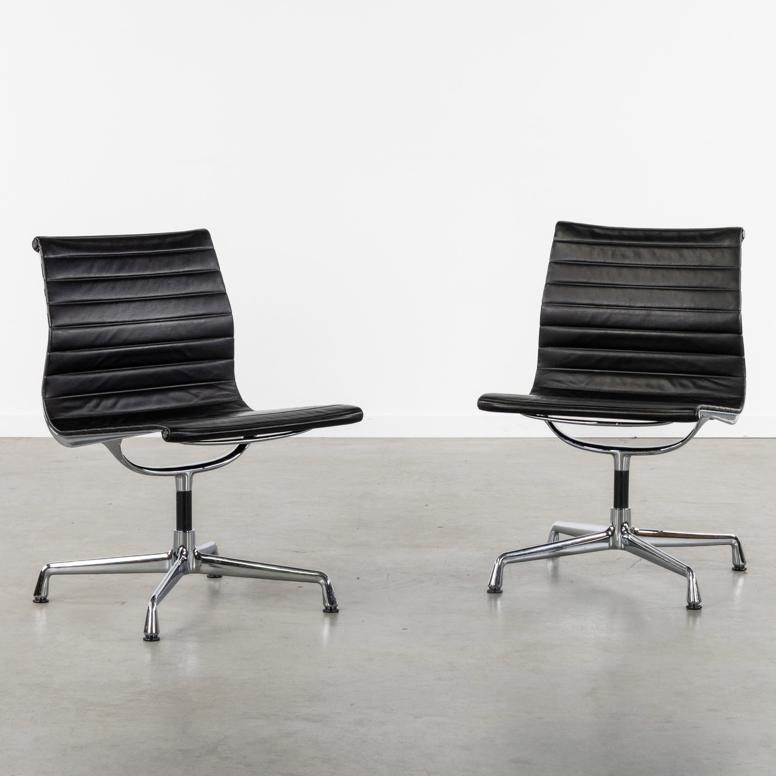 Charles & Ray Eames, (XX-XXI) 'EA 107', a pair of chairs, for Vitra, circa 1991. (1 of 8)