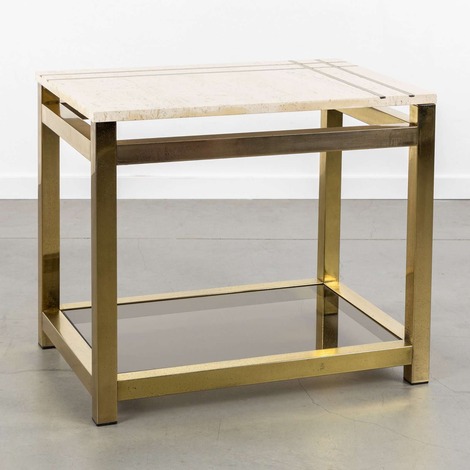 Alain Delon (1935-2024) (Attr.) a coffee table or side table, gilded metal and travertine, circa (1 of 9)