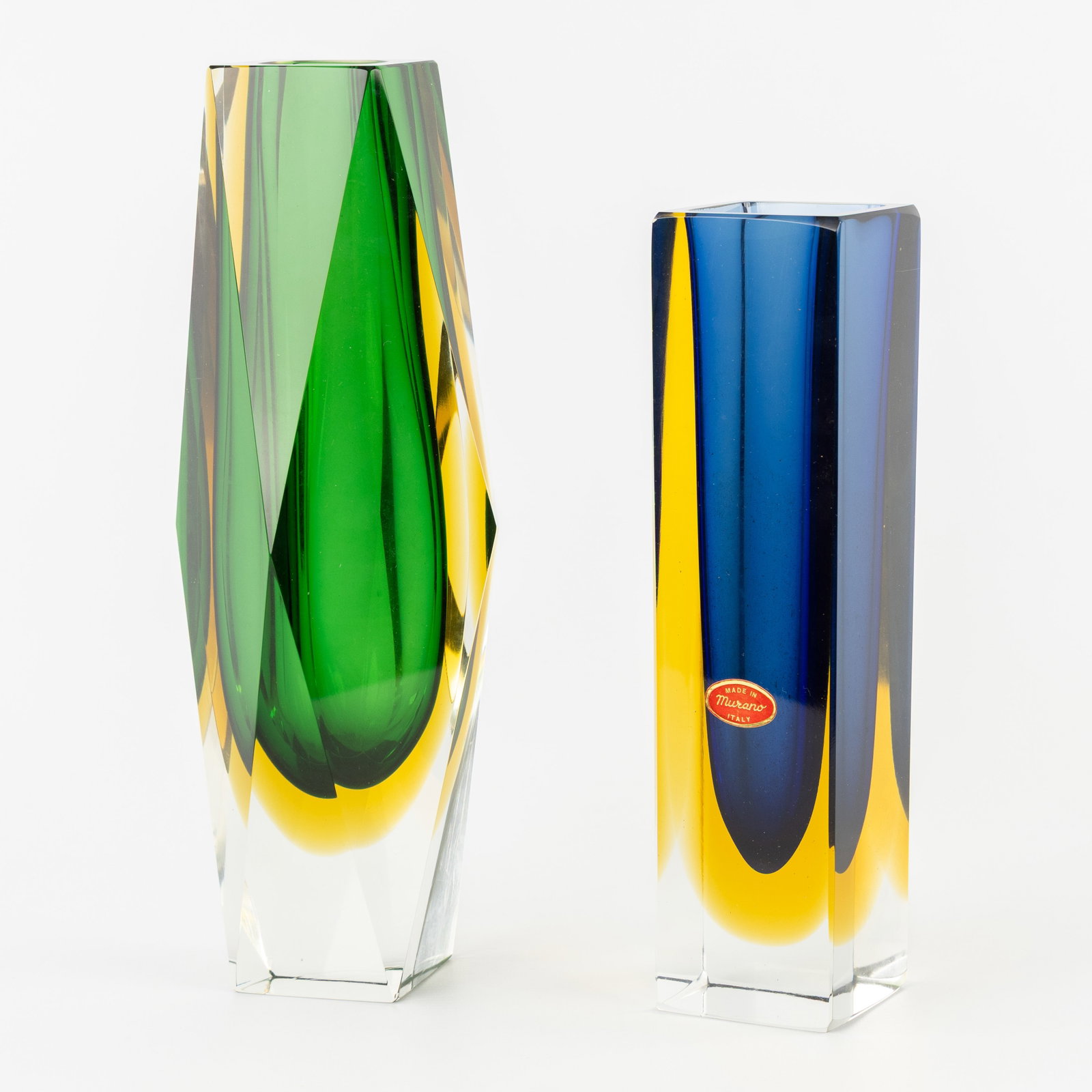 Two glass vases, Sommerso, made in Murano, Italy. Circa 1960-1970.: Two glass vases, Sommerso, made in Murano, Italy. Circa 1960-1970. One vase with the original sticker, 'Made in Murano, Italy'. H: 30 cm. H: 25,5 cm. Dimensions: (W:10 x H:30 x L:10 cm)