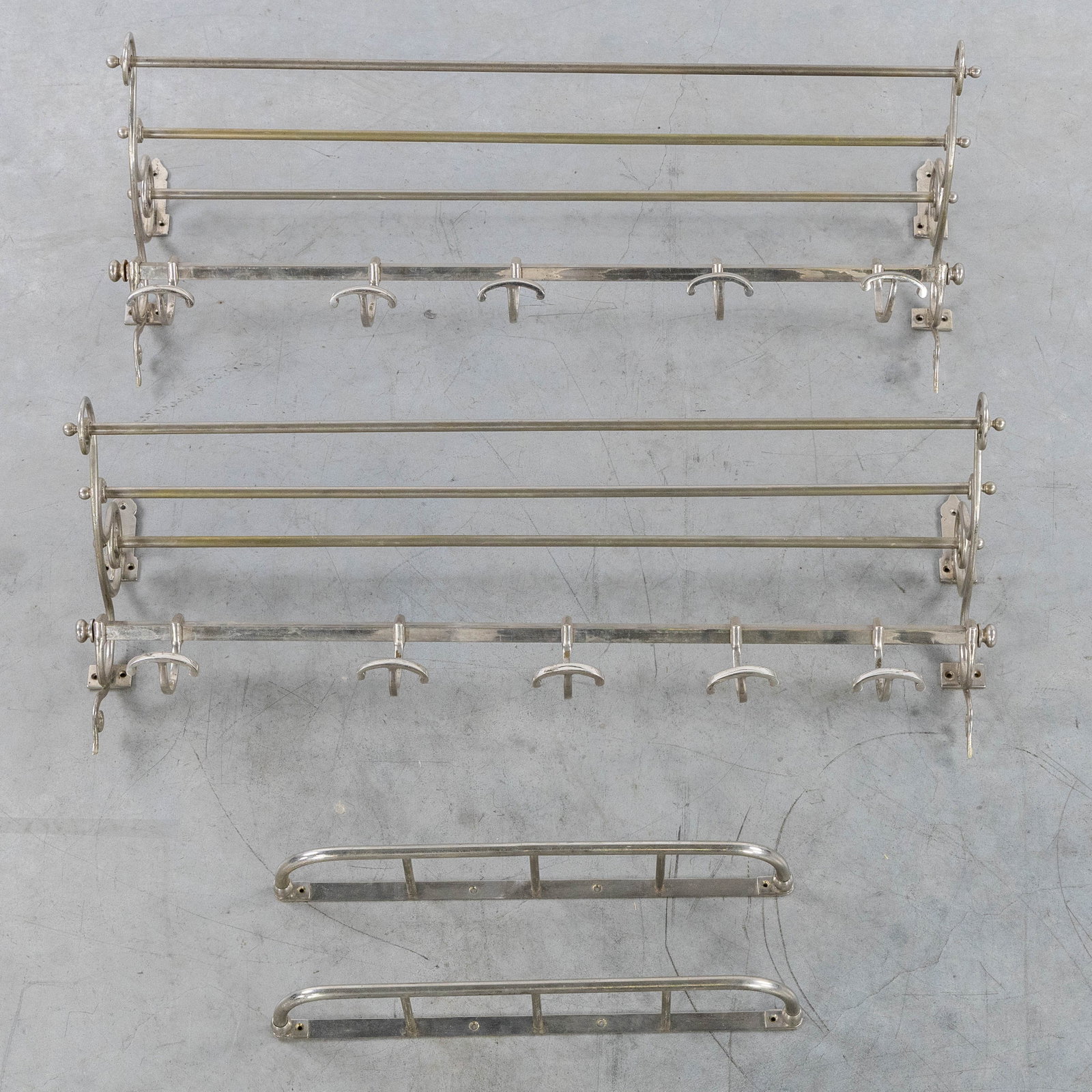 A Pair of wall coat racks with a hat shelf and two umbrella brackets, chrome-plated metal. Circa (1 of 3)