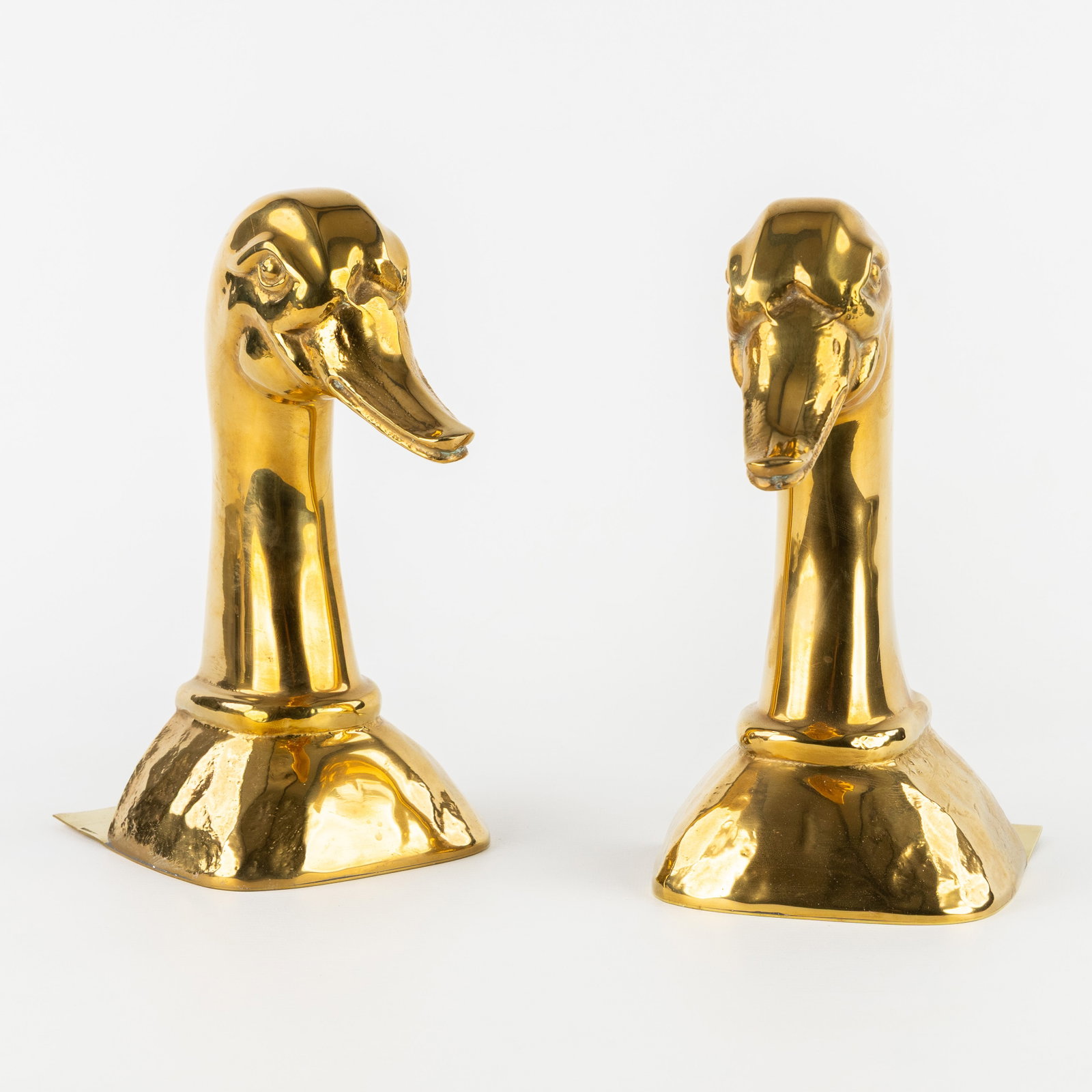 A pair of bookends in the shape of two ducks, made of polished brass. Spain, circa 1980. (1 of 9)