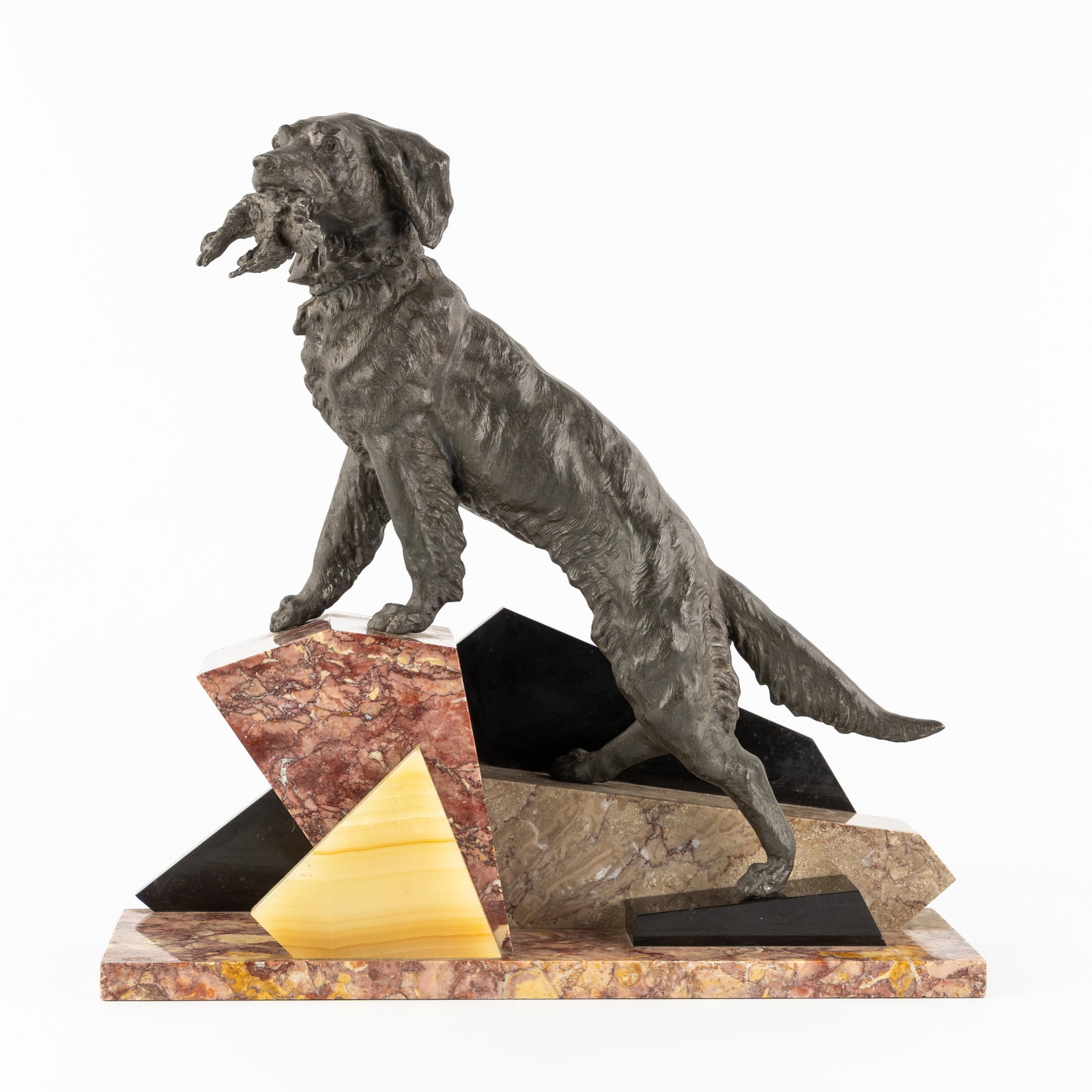 An Art Deco sculpture of a Hunting dog, patinated spelter, marble, and onyx. Art Deco, circa 1930. (1 of 6)