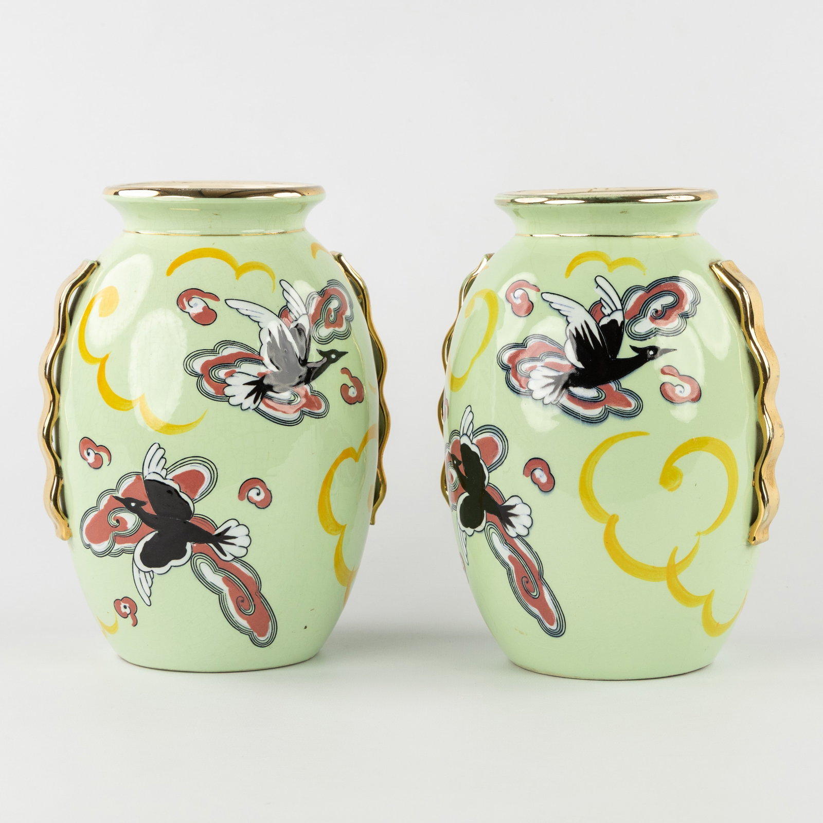 Boch Freres Keramis, a pair of vases with bird motifs. Art Deco.: Boch Freres Keramis, a pair of vases with bird motifs. Art Deco. Marked Boch Freres Keramis. Decor 5549, model 1270. Dimensions: (W:17 x H:24 x L:16 cm) The absence of a condition report does not impl