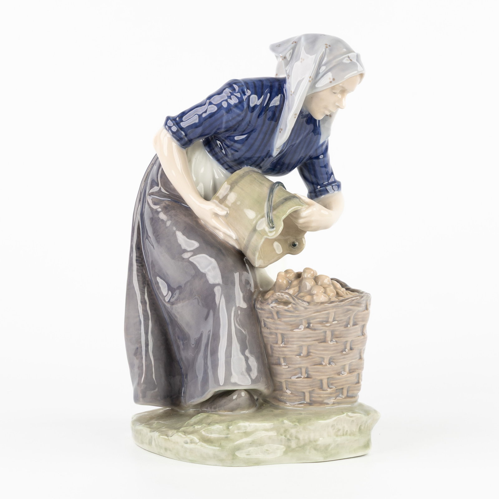 Christian Ludvig Thomsen, 'Woman Collecting Potatoes', polychrome porcelain, for Royal Copenhagen.: Christian Ludvig Thomsen, 'Woman Collecting Potatoes', polychrome porcelain, for Royal Copenhagen. Polychrome porcelain.Design by Christian Ludvig Thomsen (1860-1921), model number 1549.Marked Royal C