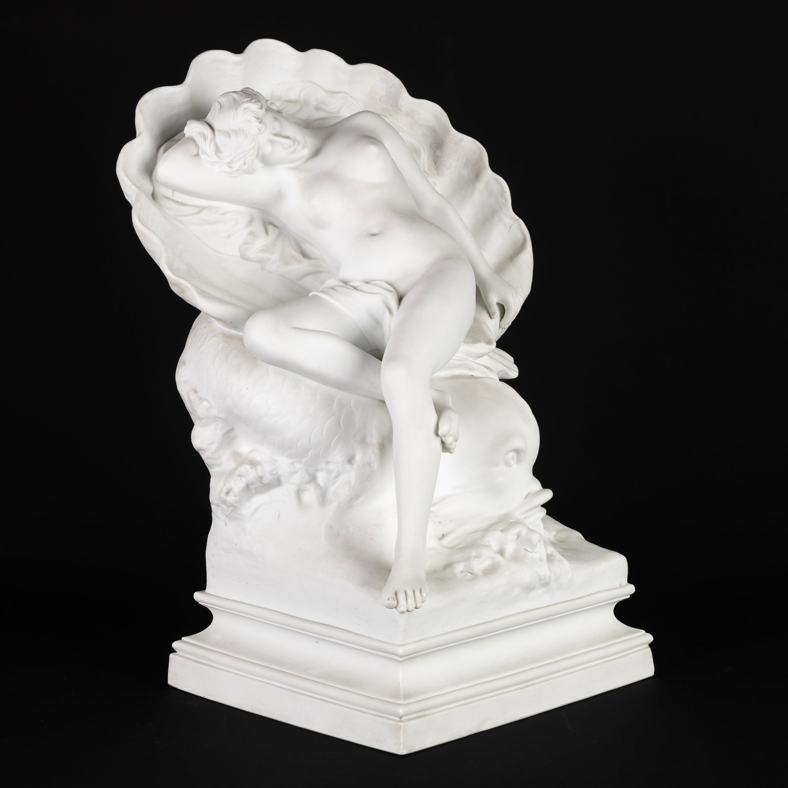 Olivieri (19th–20th centuries) 'Venus reclined in a shell, supported by a dolphin', bisque: Olivieri (19th–20th centuries) 'Venus reclined in a shell, supported by a dolphin', bisque porcelain. 19th century. Signed Oliveri. Marked E.B. Paris for the Etienne Blancheron manufactory, Paris. B