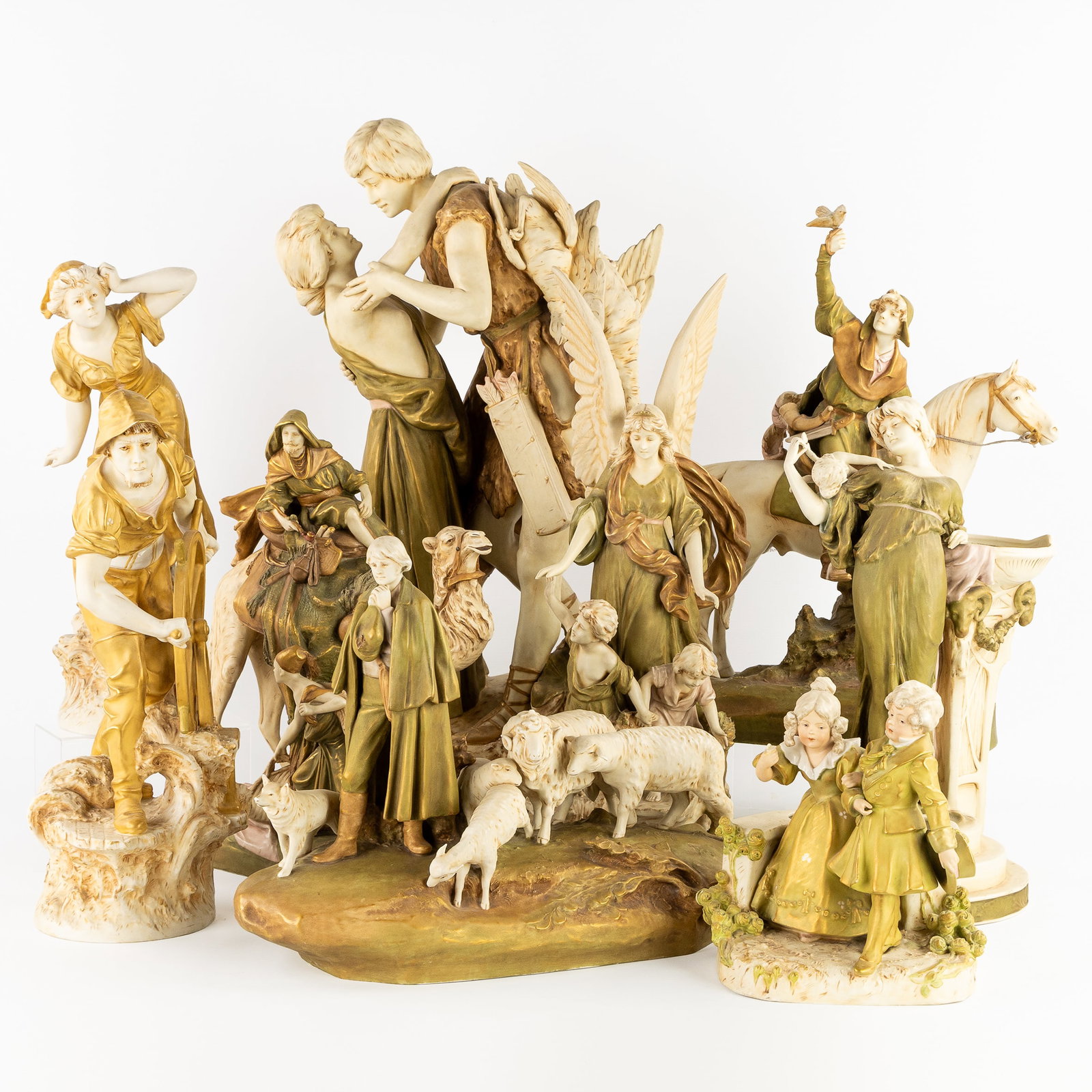 Royal Dux, Nine large figurative groups, Retour de Chasse, Merchant on a Camel, Venus and Cupid, and: Royal Dux, Nine large figurative groups, Retour de Chasse, Merchant on a Camel, Venus and Cupid, and others, 20th century. Polychrome glazed ceramics.An Art Nouveau vase, 'Venus and Cupid' (H: 46 cm).