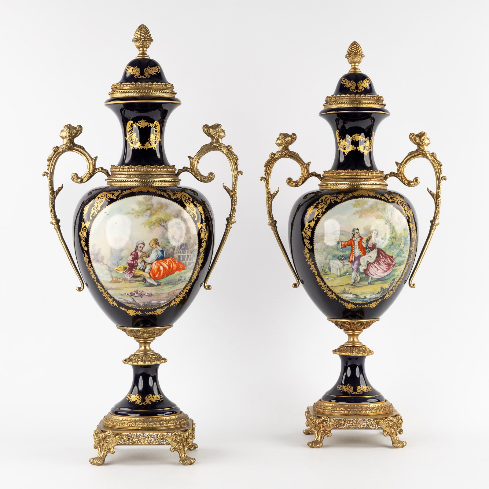 A pair of large, decorative lidded vases in the Sèvres style, mounted with gilded bronze, 20th C. (1 of 9)