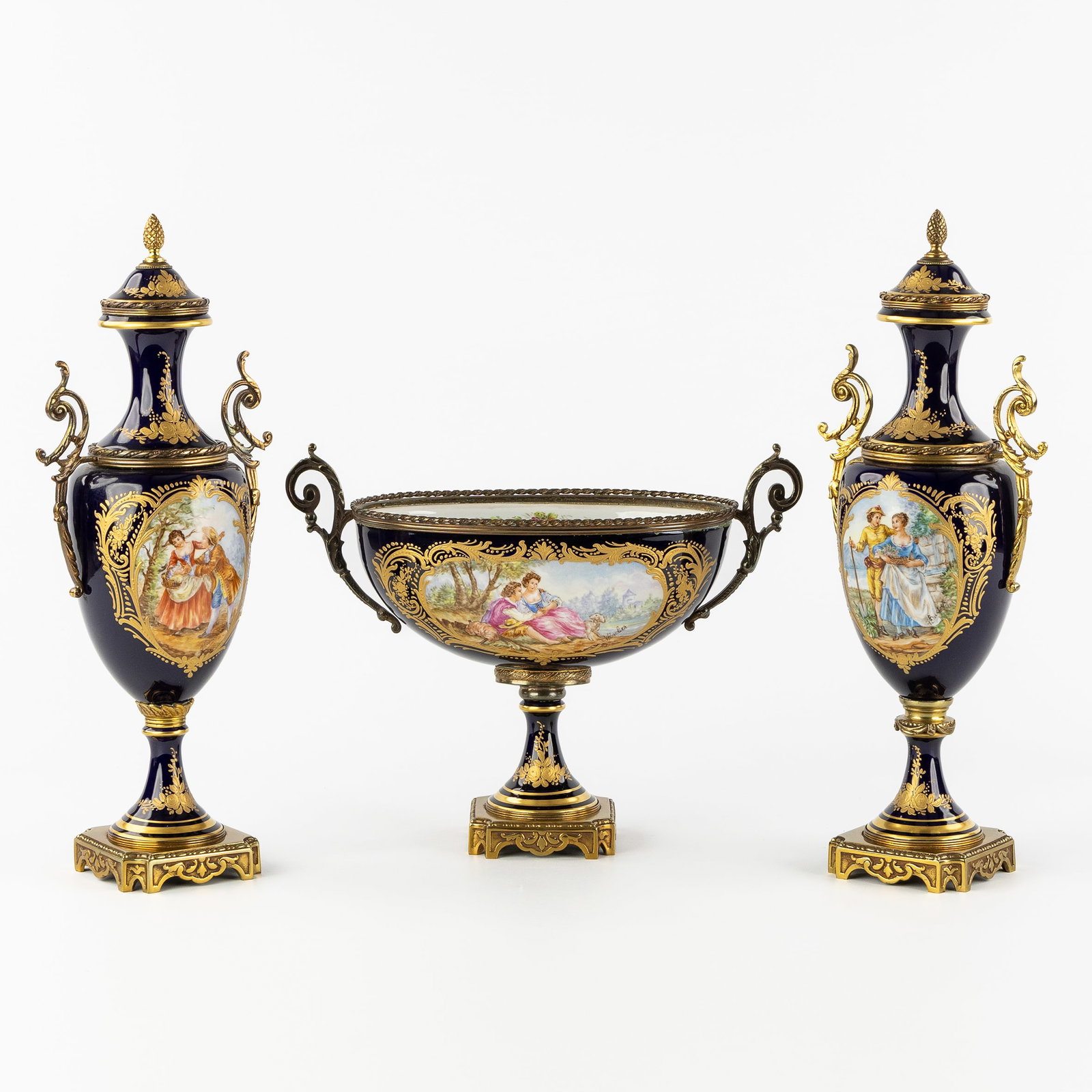 Sèvres, a three-piece garniture, a pair of vases and a bowl, Cobalt blue porcelain with (1 of 14)