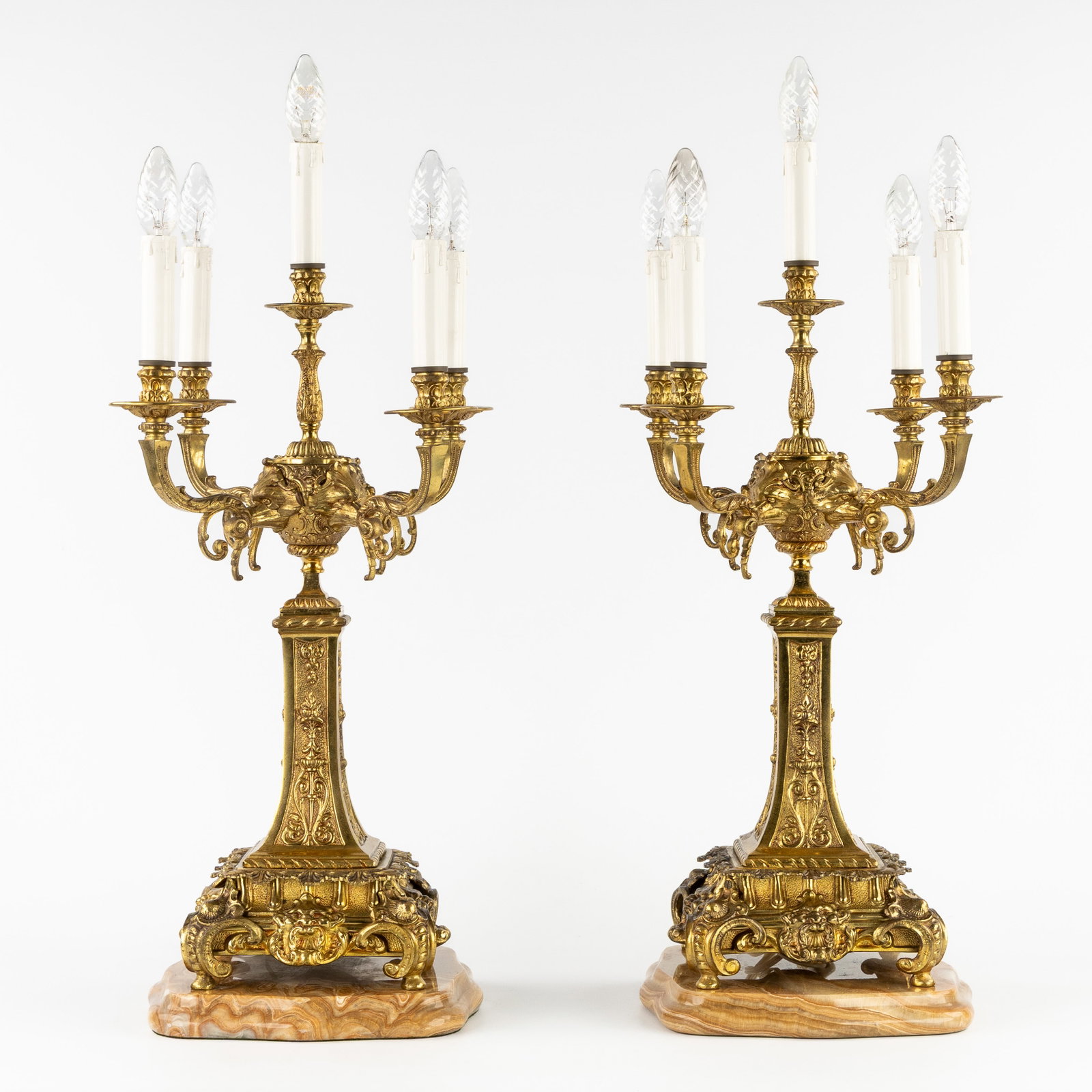 A pair of large table candelabra, gilded bronze in a Louis XVI style mounted on an onyx base. 20th (1 of 6)