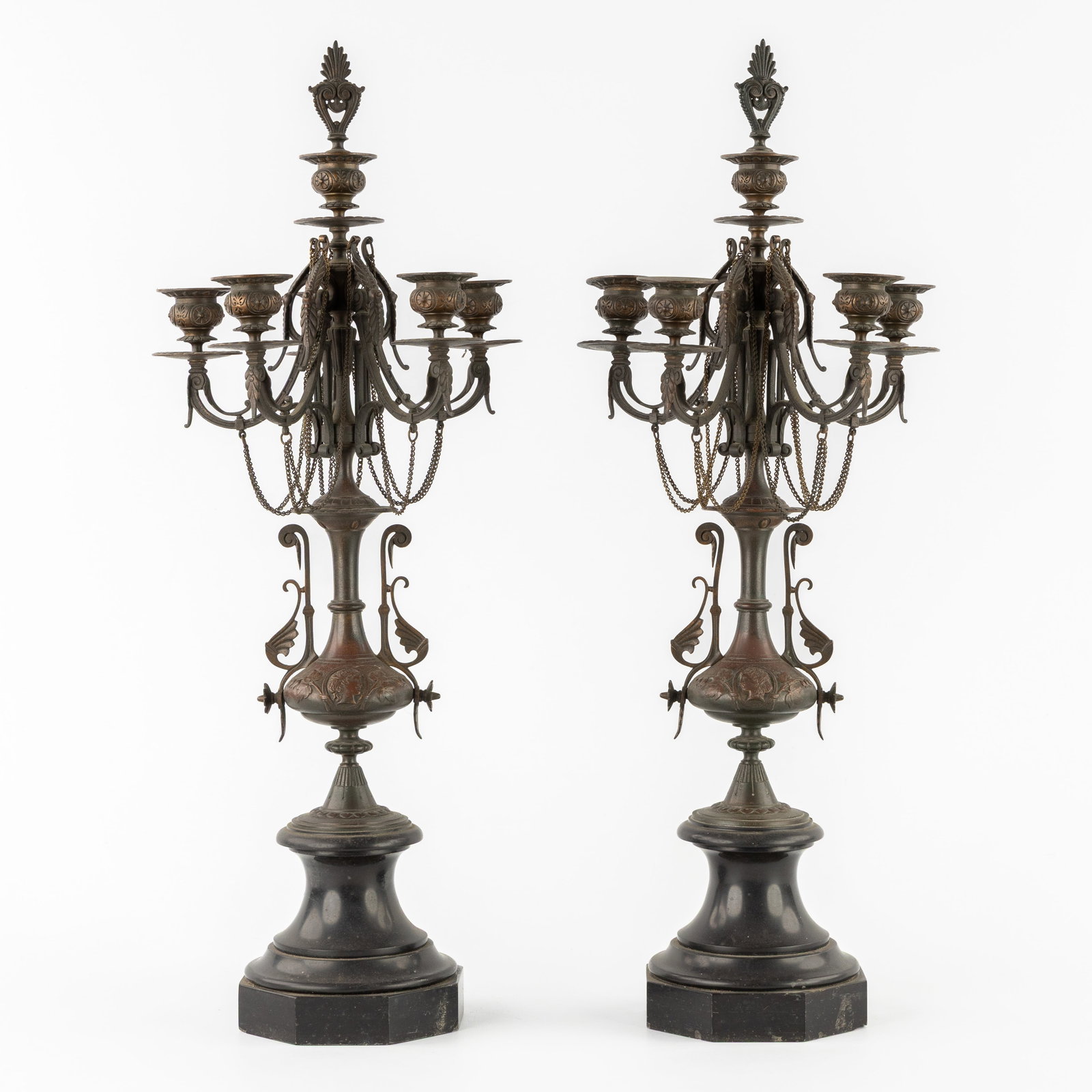 A pair of candlesticks, patinated bronze in the Napoleon III style. Late 19th C.: A pair of candlesticks, patinated bronze in the Napoleon III style. Late 19th century. A pair of candlesticks with 6 candle holders, finished with chains in the Napoleon III style. France, late 19th c