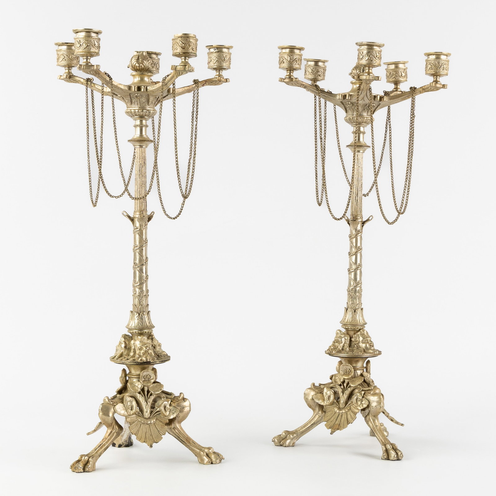 A Pair of Neoclassical candelabra with Grotesques and Lion's paws, silver-plated metal, Napoleon: A Pair of Neoclassical candelabra with Grotesques and Lion's paws, silver-plated metal, Napoleon III, France, 19th century. Silver-plated metal.Candelabra with five candle holders.Decorated with grote