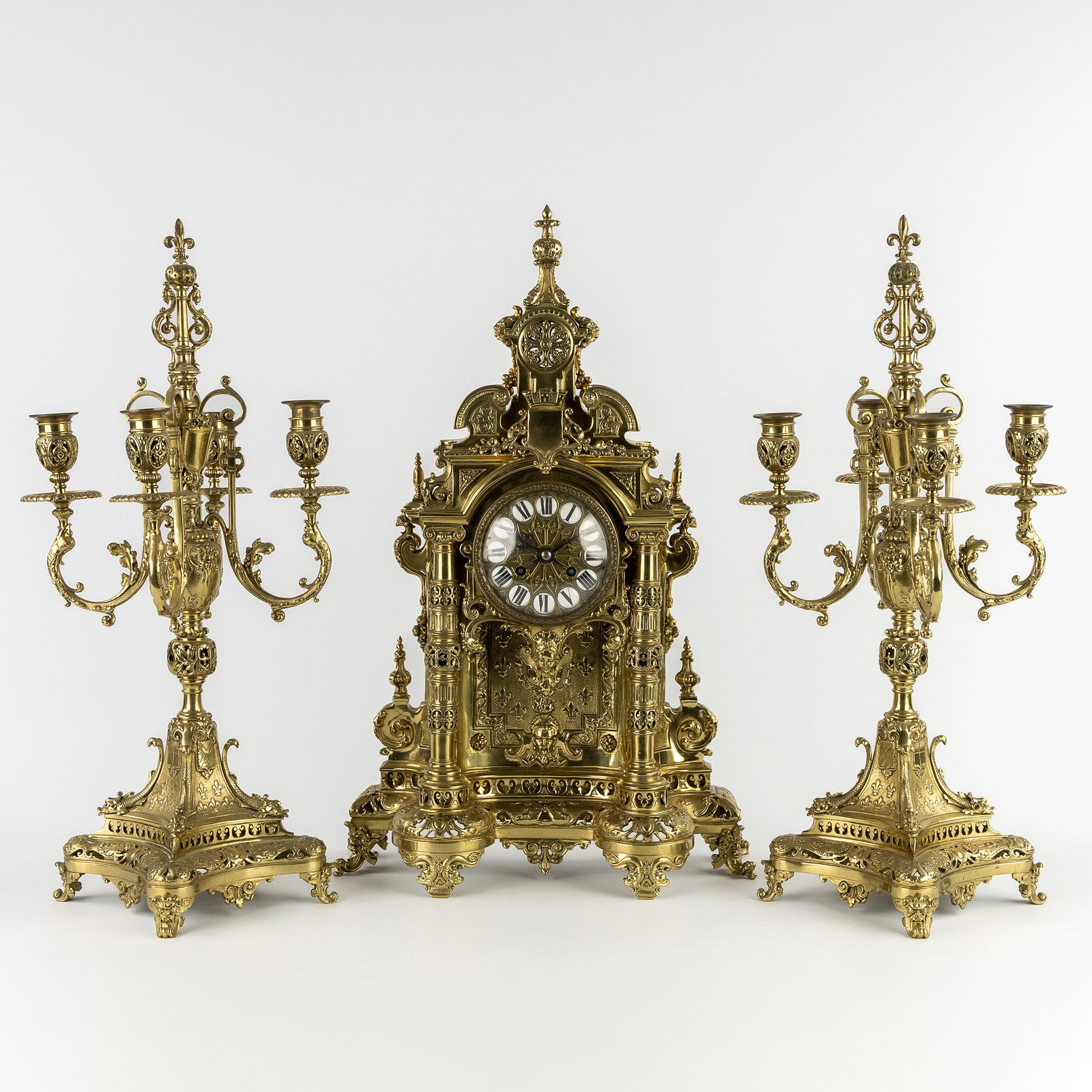A three-piece mantelpiece set, decorated with the Cross of St. George, a clock and candelabra, (1 of 9)