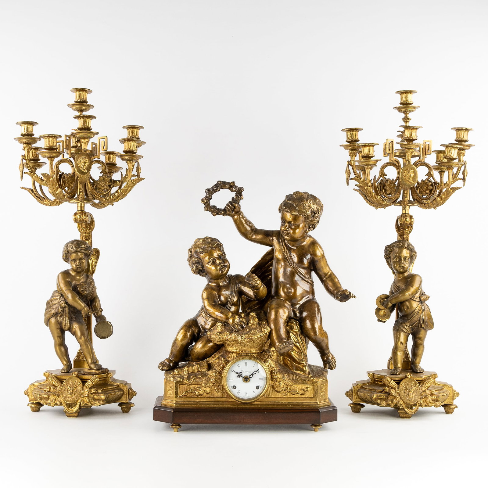 A Large three-piece mantel garniture, gilded bronze, clock and candelabra, mounted with Putti, 20th (1 of 10)