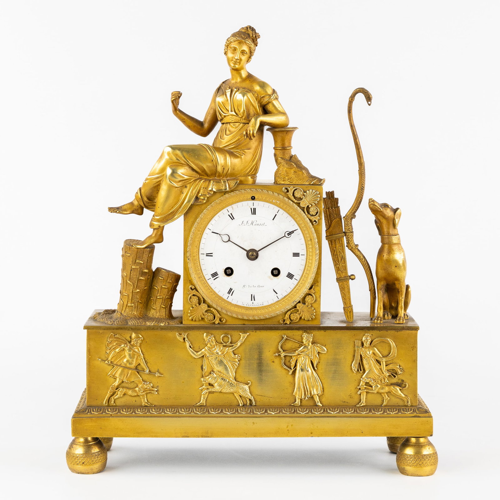 An Ormolu Mantel Clock, Diana Venatrix, Empire Style, 19th C.: An Ormolu Mantel Clock, Diana Venatrix, Empire Style, 19th century. Fire-gilded or ormolu table clock.Bronze.Mounted with Diana Venatrix, goddess of the hunt, with a quiver, bow, and hunting dog.Dial 
