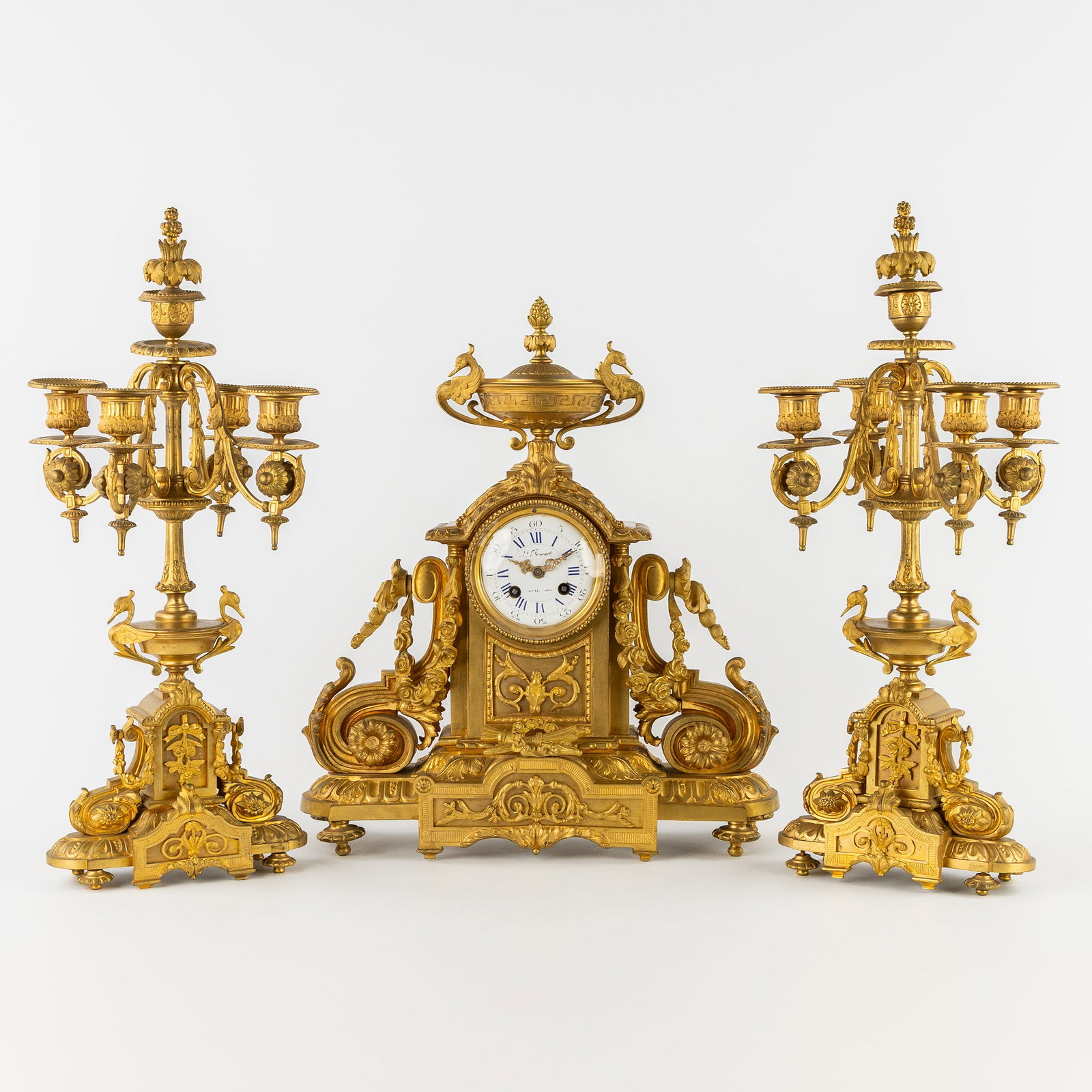 A richly decorated three-piece mantelpiece set, clock and candelabra, gilt bronze, Louis XVI style. (1 of 11)