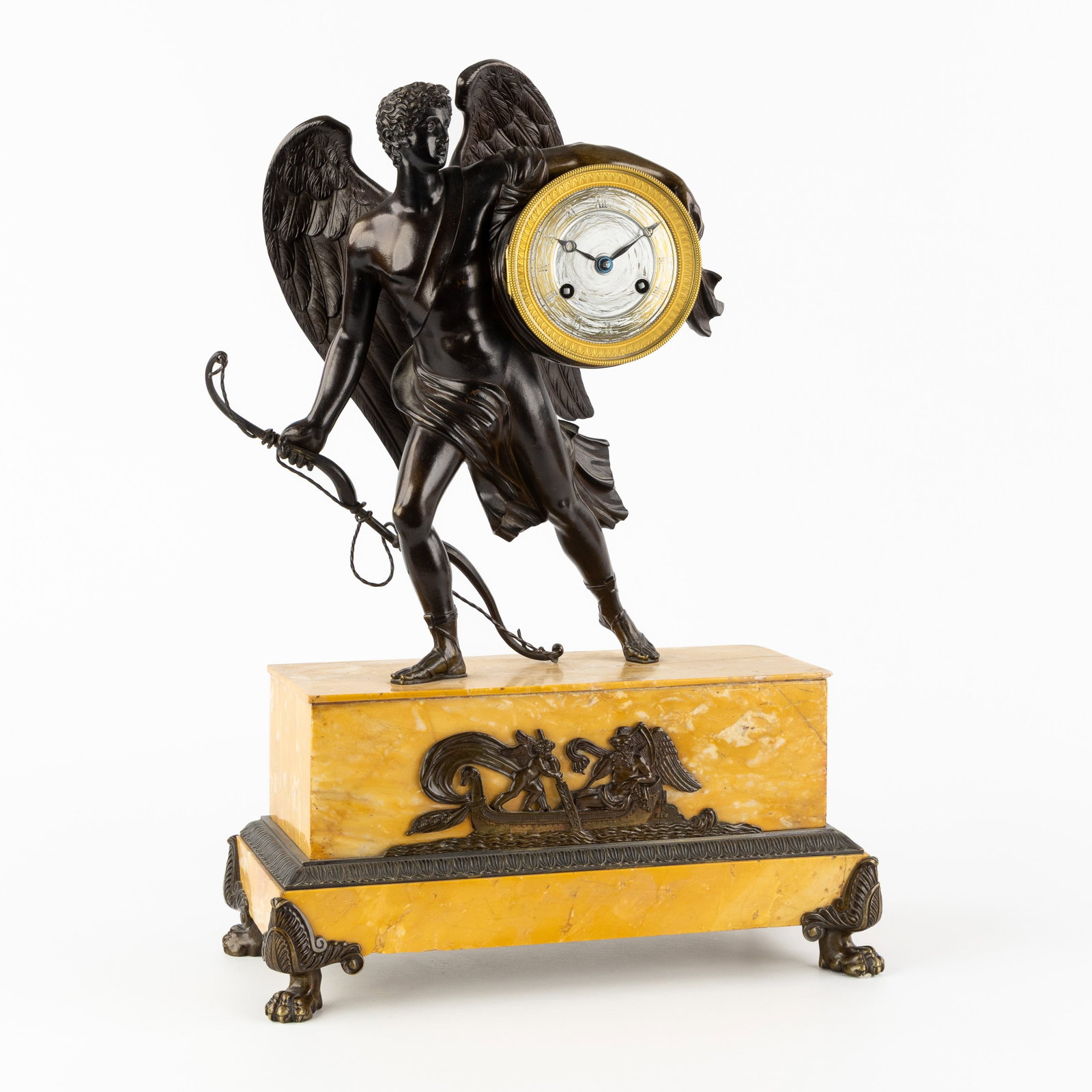 A Mantel clock, mounted with Amor or Eros, patinated bronze and Sienna marble, circa 1900. (1 of 9)