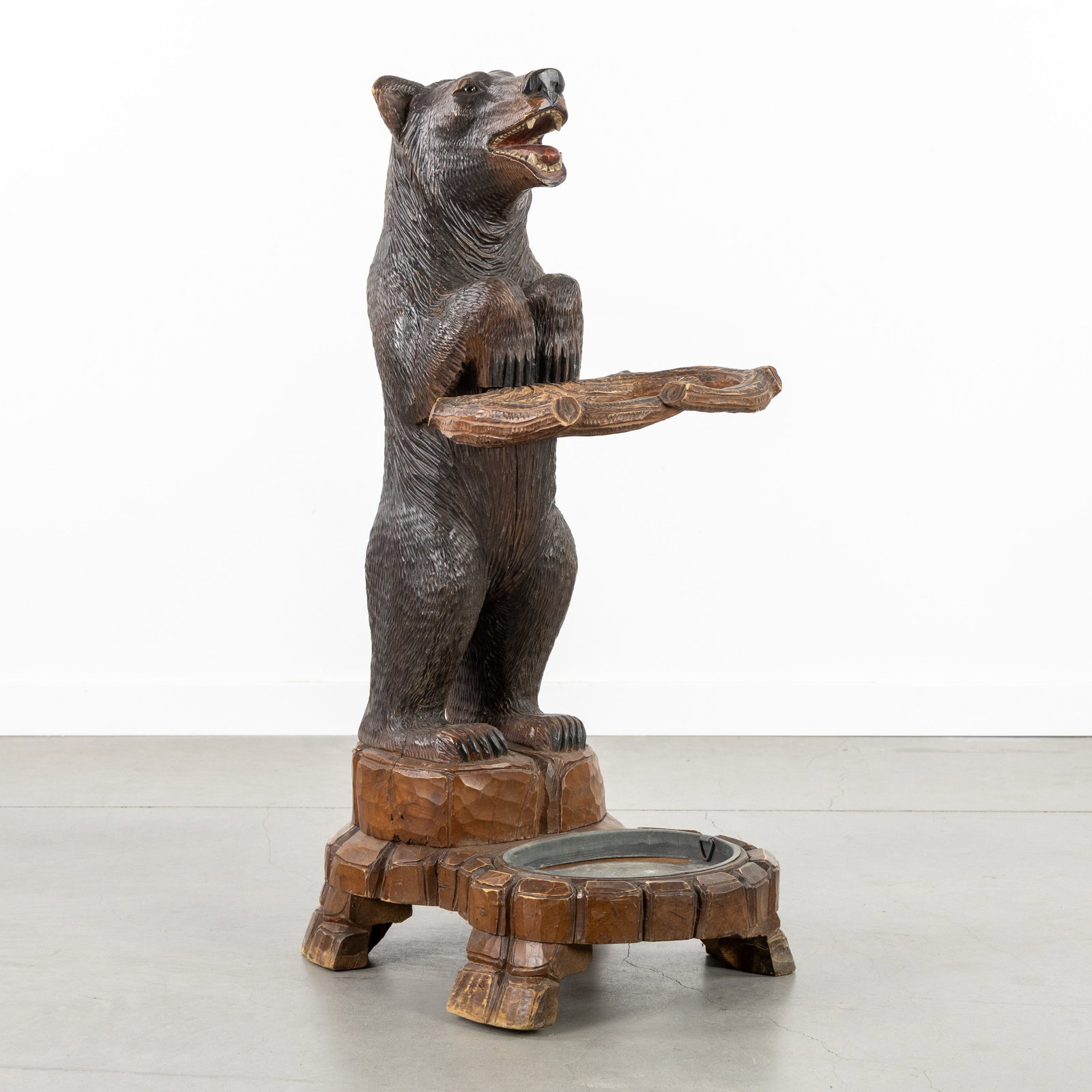 A Bear-shaped umbrella stand, in the style of Mieringer Holzschnitzerei, Black Forest, circa 1900. (1 of 8)