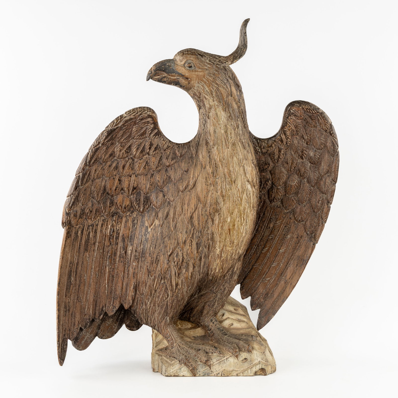 A Large wood-sculptured eagle, polychrome patinated, 19th C. (1 of 9)