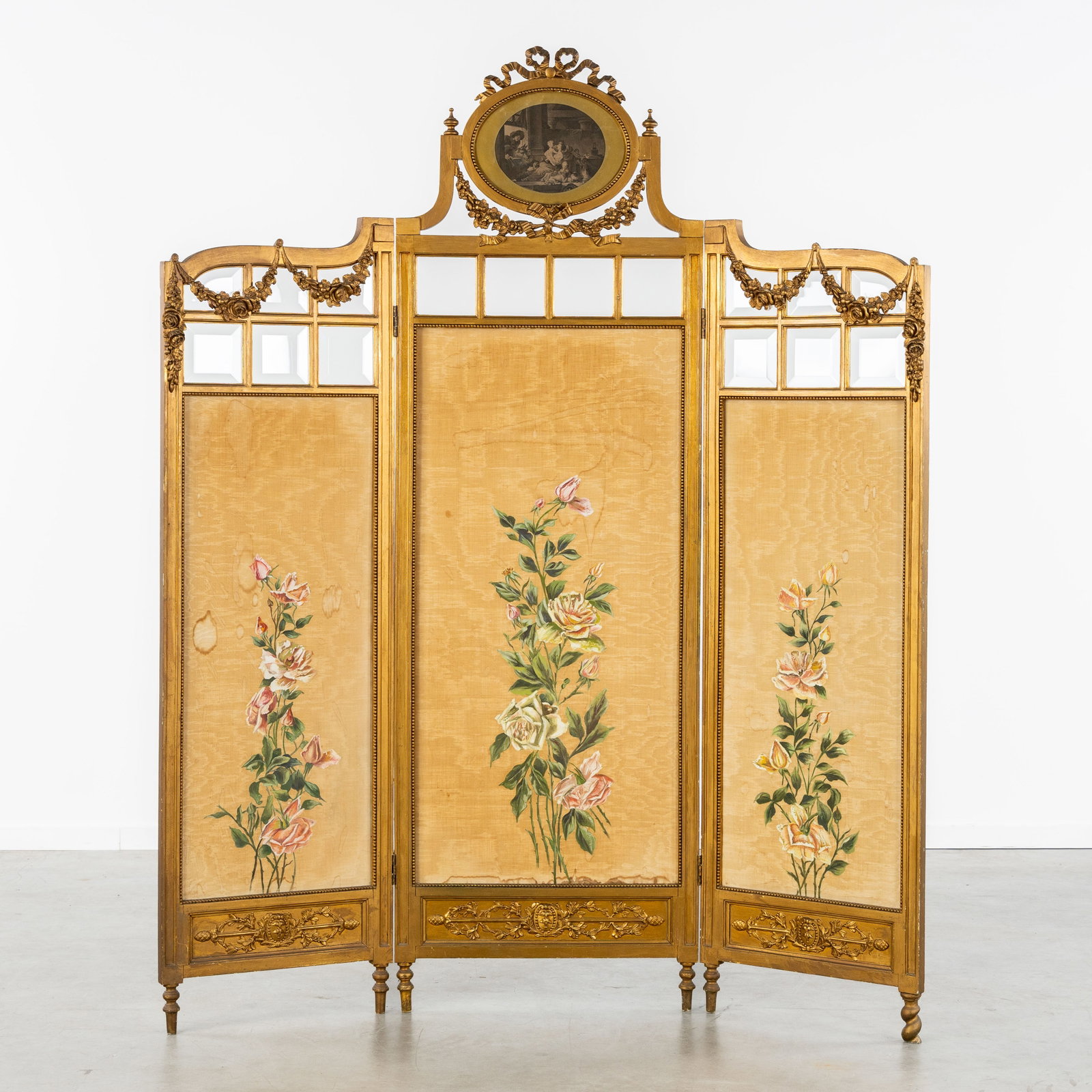 A Triptych Room divider, Silk panels with hand-painted Rose decorations, Sculptured and gilded wood,: A Triptych Room divider, Silk panels with hand-painted Rose decorations, Sculptured and gilded wood, Louis XVI style. Sculptured and gilded wood, glass, and silk.Three-part room divider, decorated wit