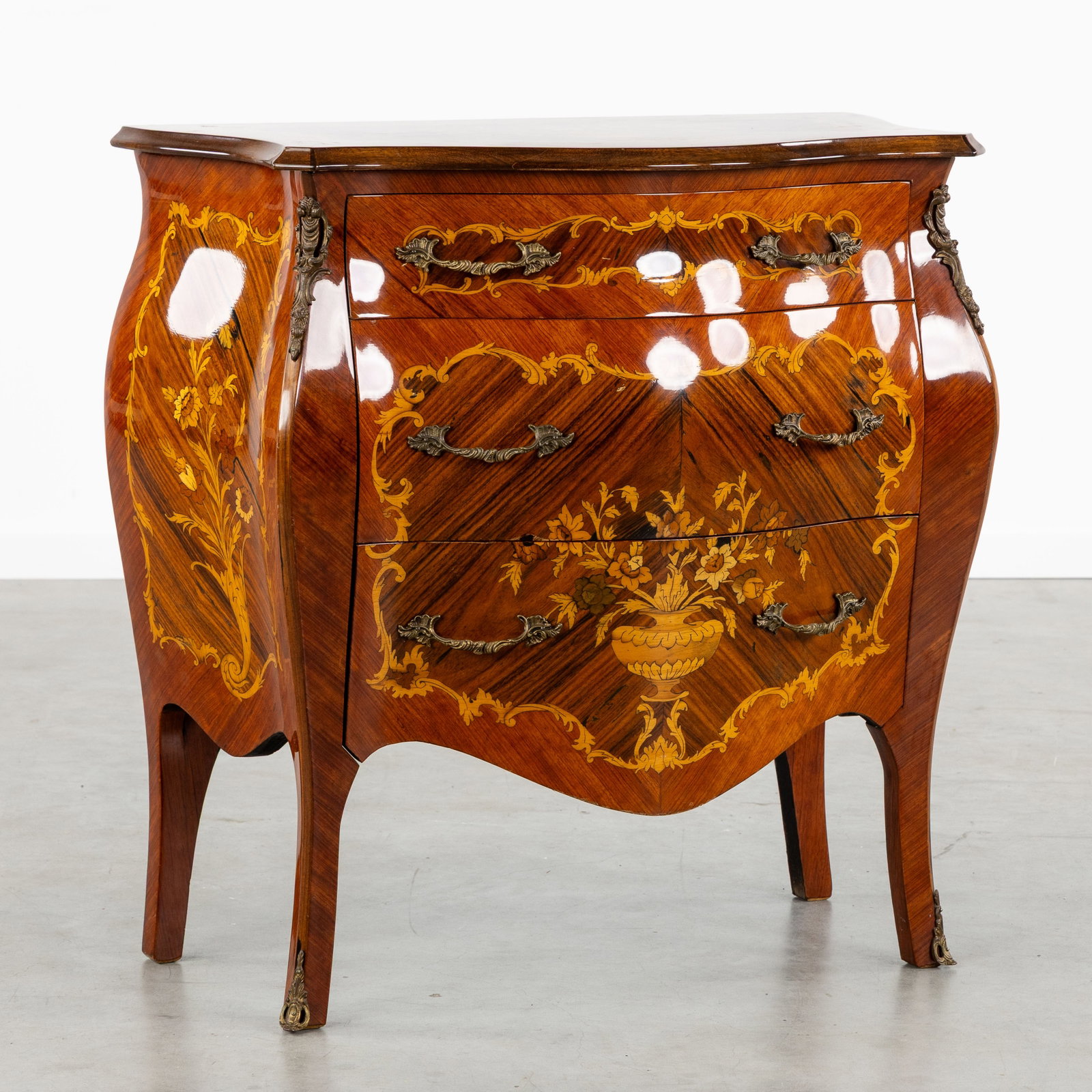A Commode or Chest of Drawers, Louis XV style, Floral marquetry and bronze fittings. (1 of 9)