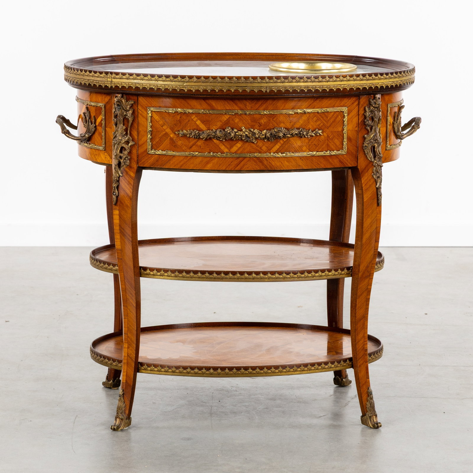 An Oval side table or serving table with a marble top and ice bucket, marquetry and bronze fittings, (1 of 7)