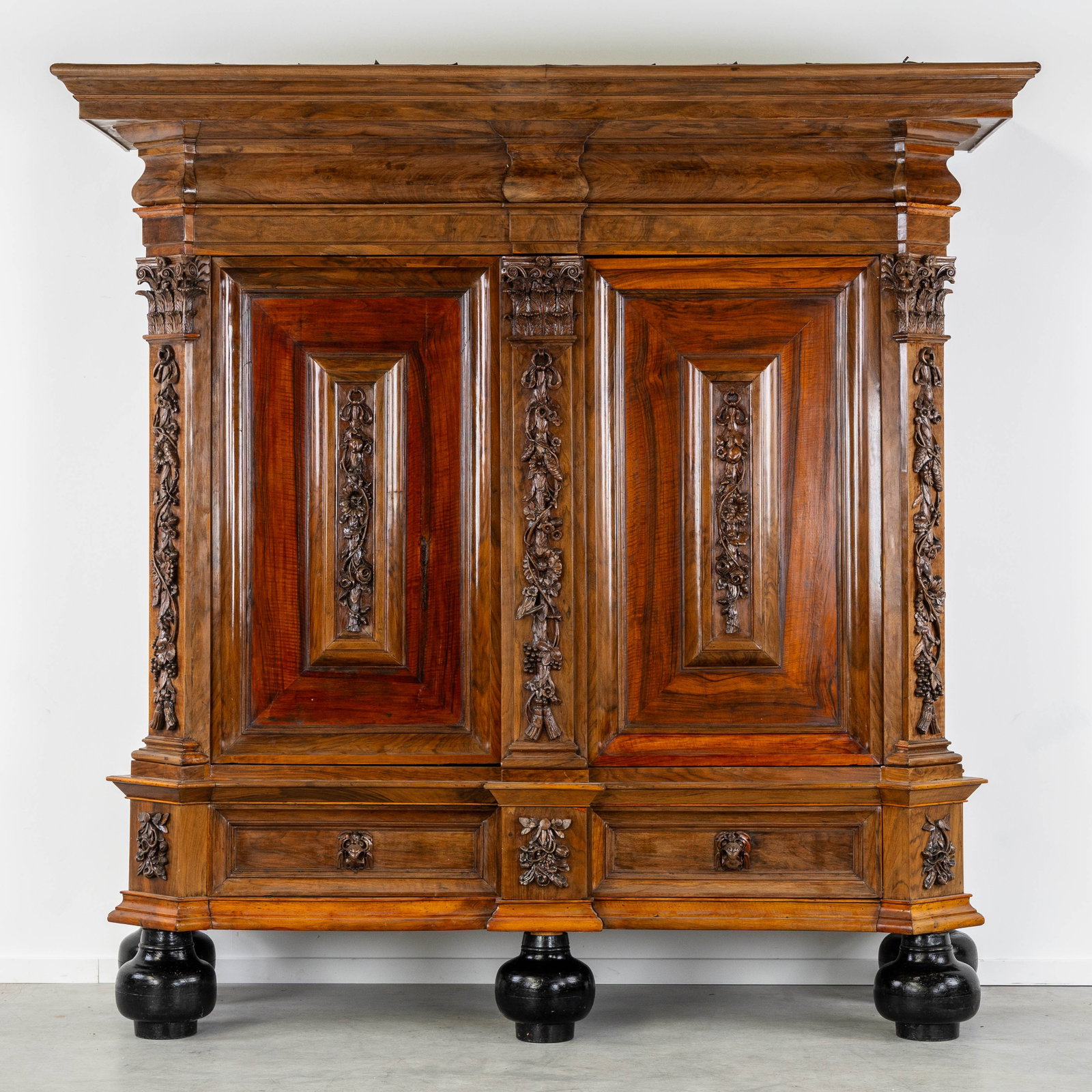 An Antique Wardrobe or 'Kapiteelkast', decorated with sculptured Floral wreaths and Eagle heads, (1 of 13)