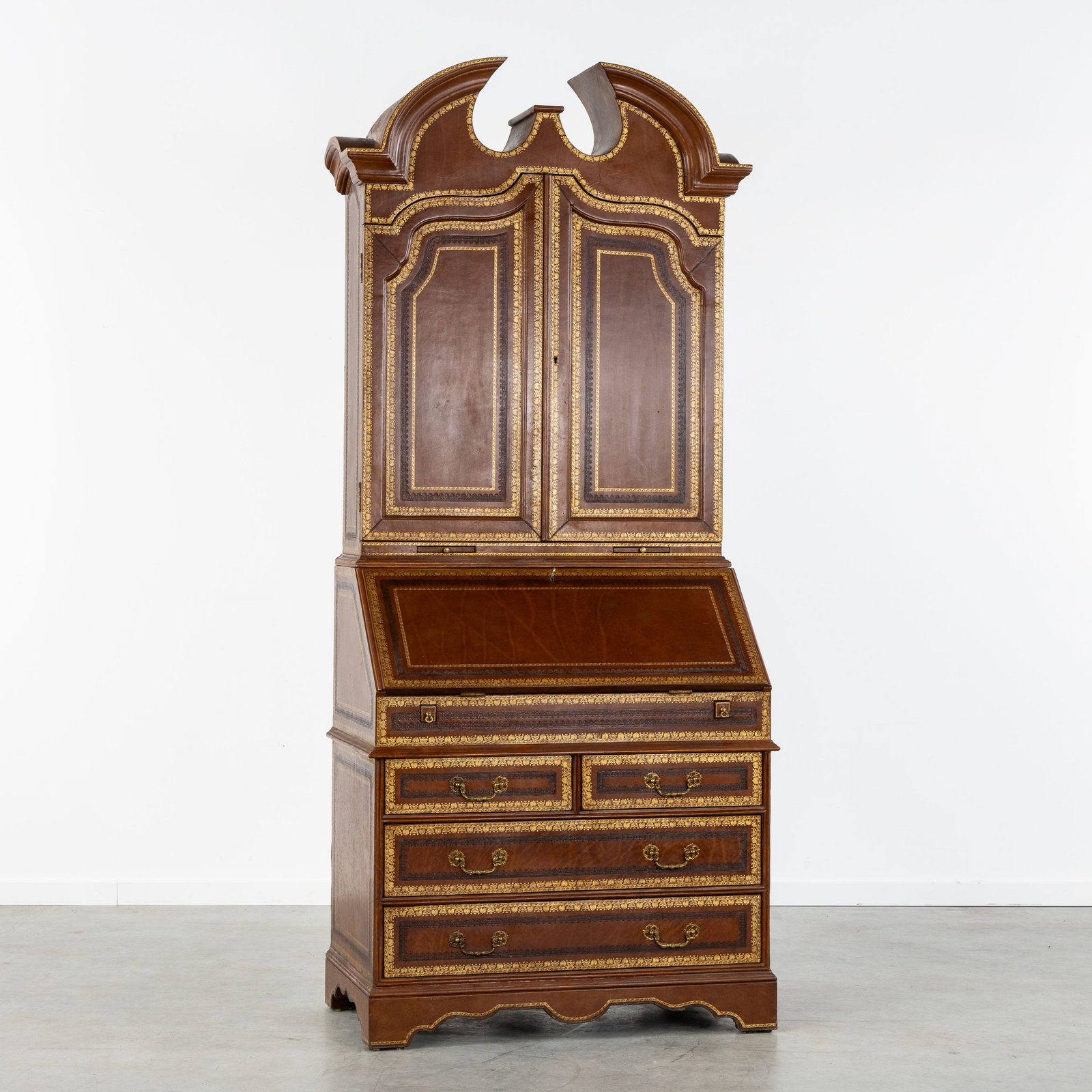 A Leather-covered 'Deux Corps' secretary cabinet, English style. (1 of 11)