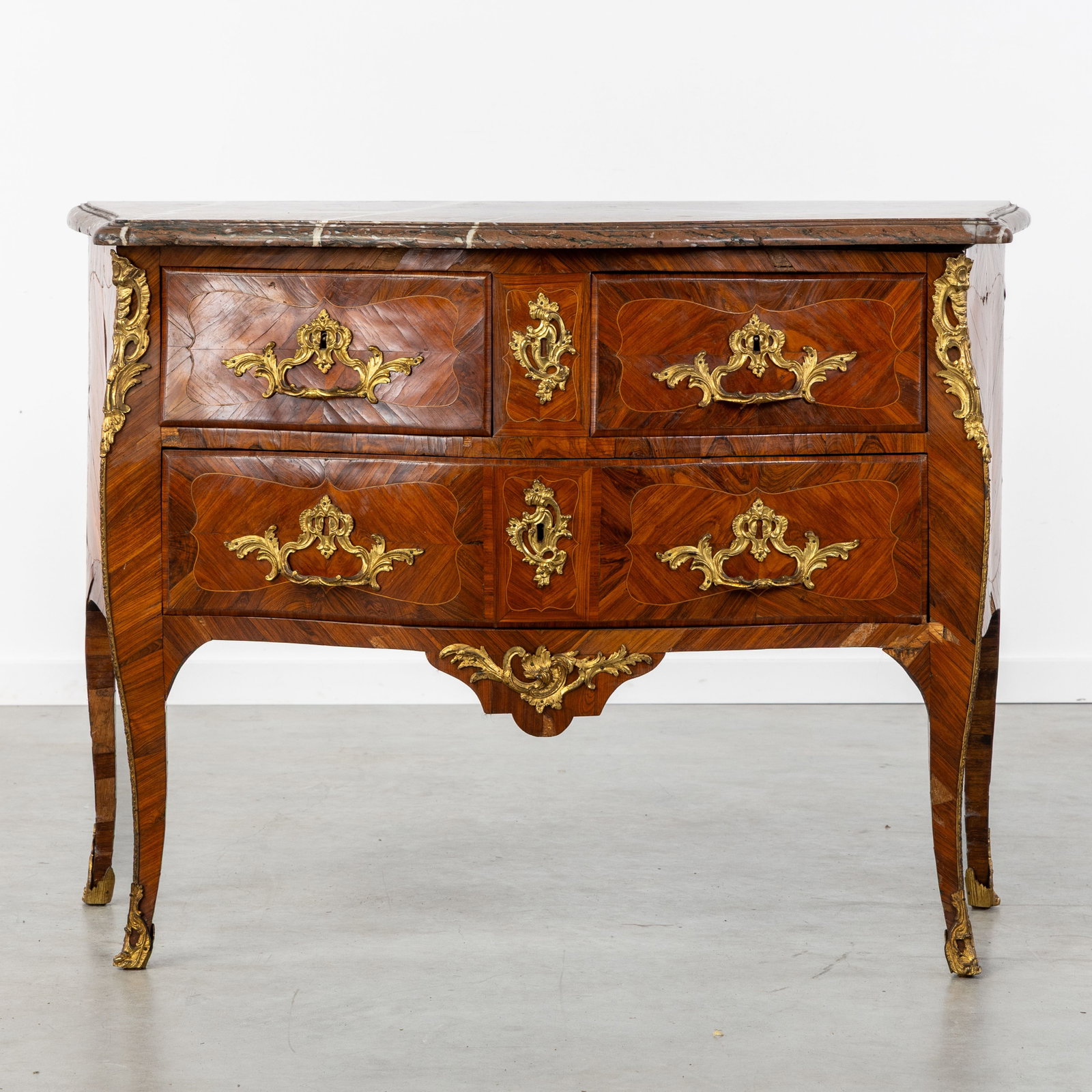An Antique Louis XV commode with Rouge Royale marble top, marquetry and bronze fittings, stamped (1 of 13)