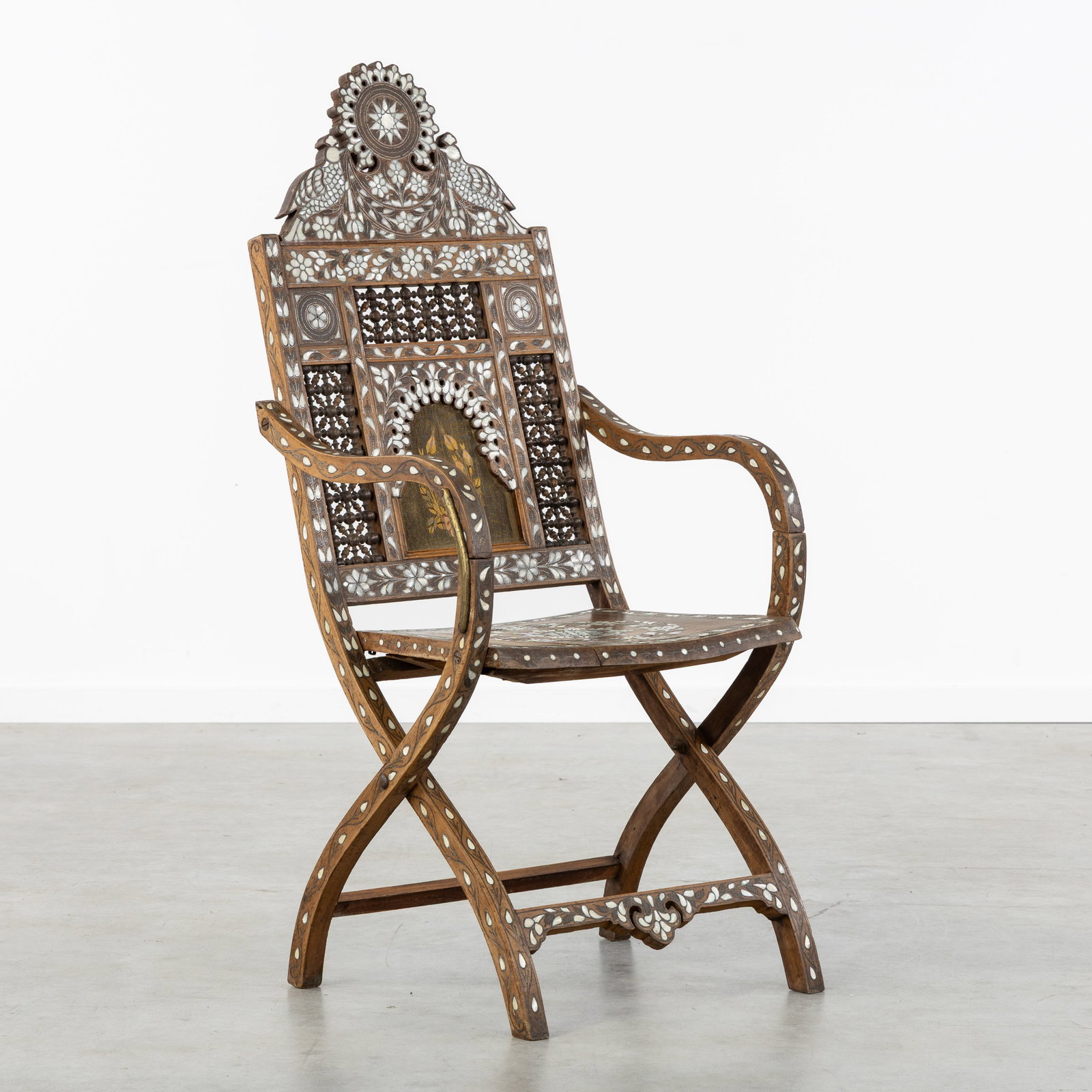 A Syrian armchair or nomad chair, Sculptured wood, Mother-of-pearl and brass inlay. (1 of 11)
