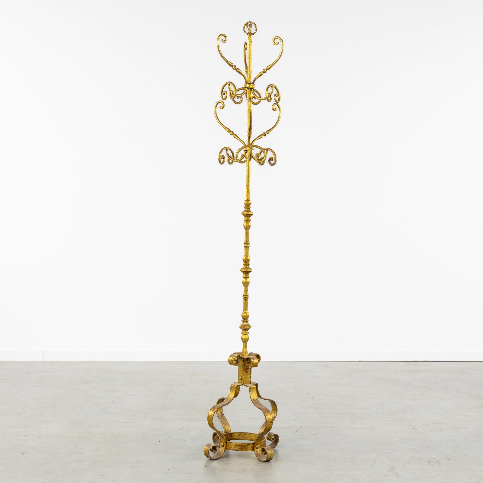 A Decorative coat rack, gilded wrought iron.: A Decorative coat rack, gilded wrought iron. Dimensions: (W:39 x H:183 x L:39 cm) The absence of a condition report does not imply a perfect item. Please send us an e-mail to request a condition repor
