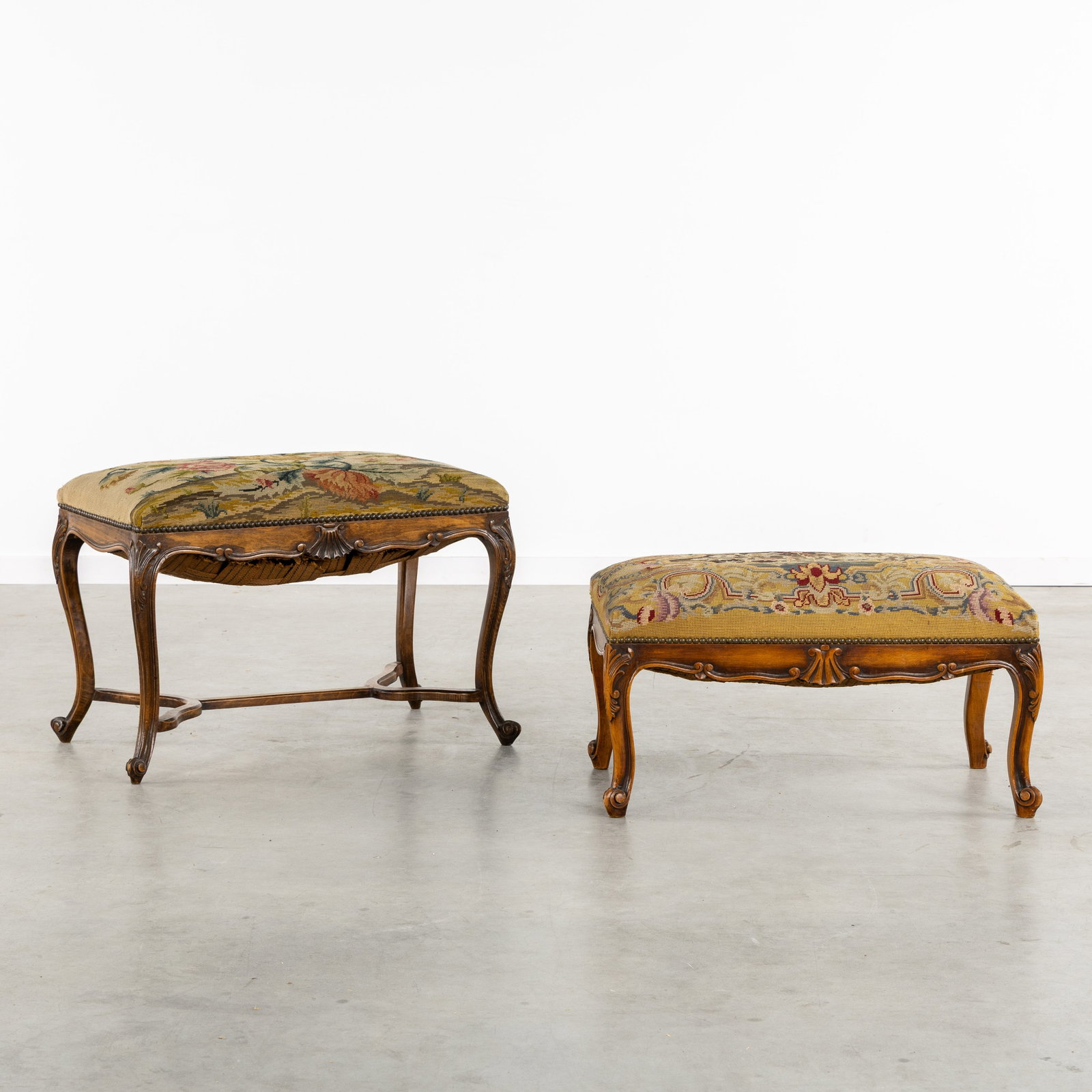 Two Wood-Sculptured Benches or Ottomans, upholstered with embroidery, Louis XV style, circa 1900.: Two Wood-Sculptured Benches or Ottomans, upholstered with embroidery, Louis XV style, circa 1900. Sculptured wood.Bench, ottoman, or piano stool, with floral embroidery (H: 51 cm x W: 76 cm x D: 42 cm